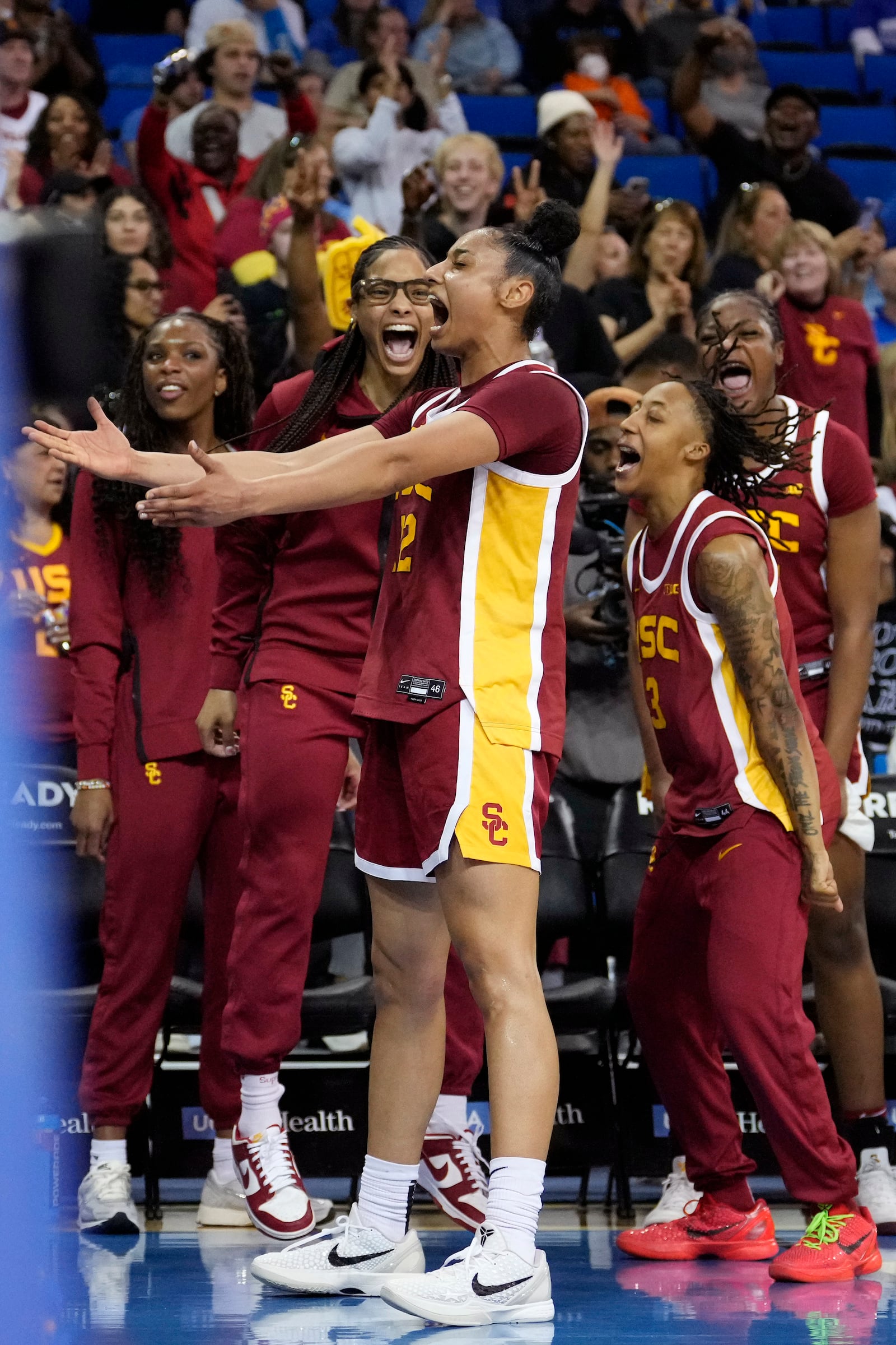 Southern California guard JuJu Watkins, center, celebrates with teammates during the second half of an NCAA college basketball game against UCLA Saturday, March 1, 2025, in Los Angeles. (AP Photo/Mark J. Terrill)