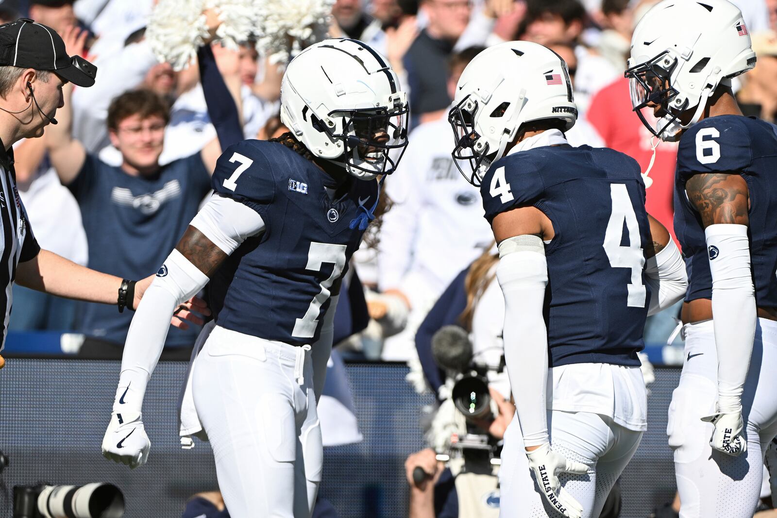 Penn State cornerback Zion Tracy (7) celebrates with A.J. Harris (4) after returning an interception for a touchdown against Ohio State during the first quarter of an NCAA college football game, Saturday, Nov. 2, 2024, in State College, Pa. (AP Photo/Barry Reeger)