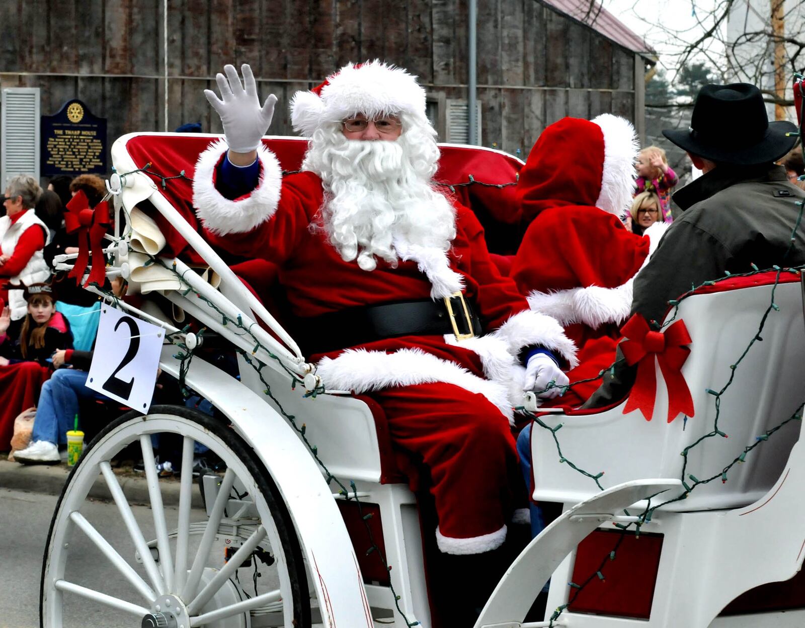 Santa and Mrs. Claus wave from their carriage as they ride in the Lebanon Carriage Parade. FILE PHOTO