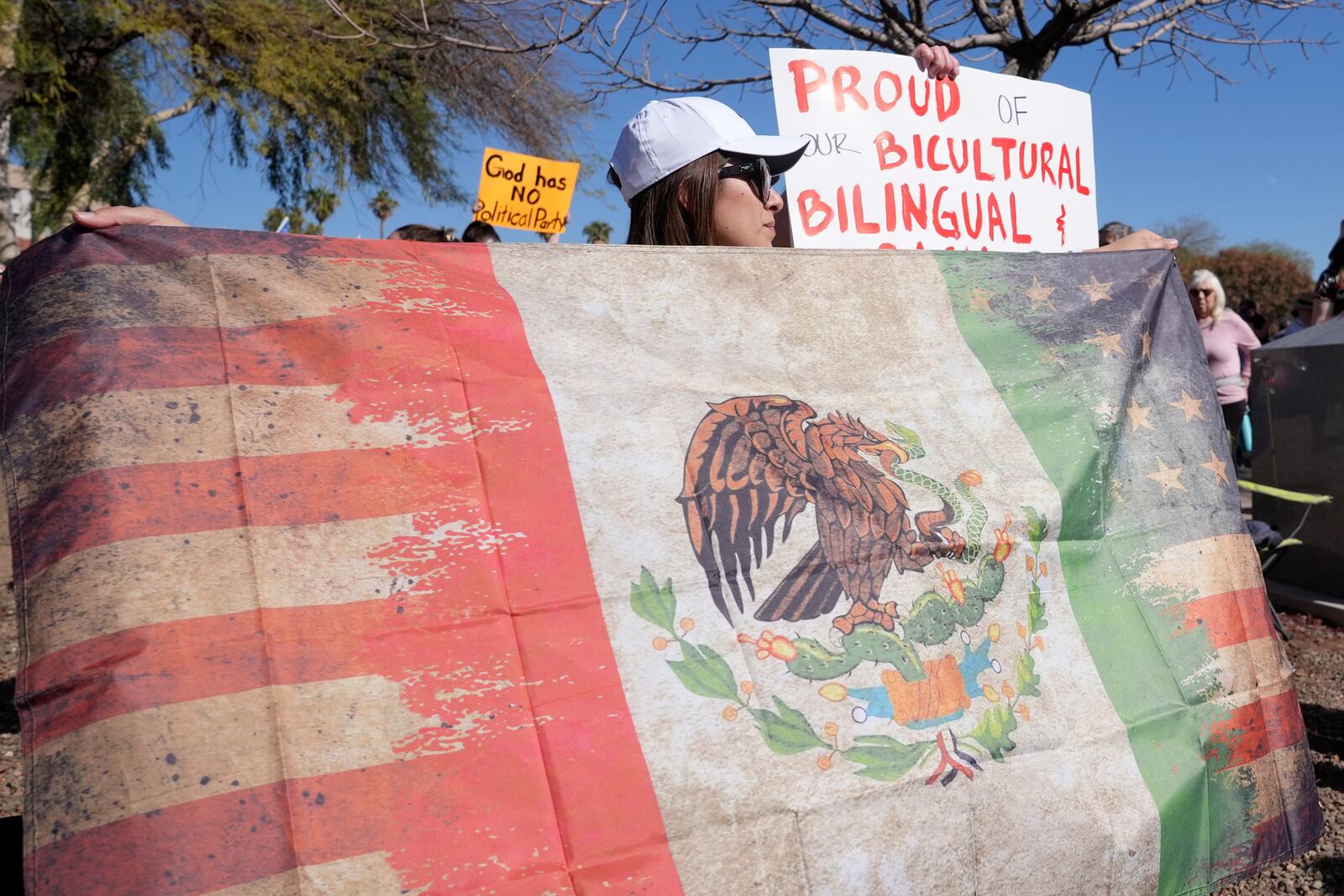 Hundreds gather during a political protest at the Arizona Capitol Wednesday, Feb. 5, 2025, in Phoenix. (AP Photo/Ross D. Franklin)