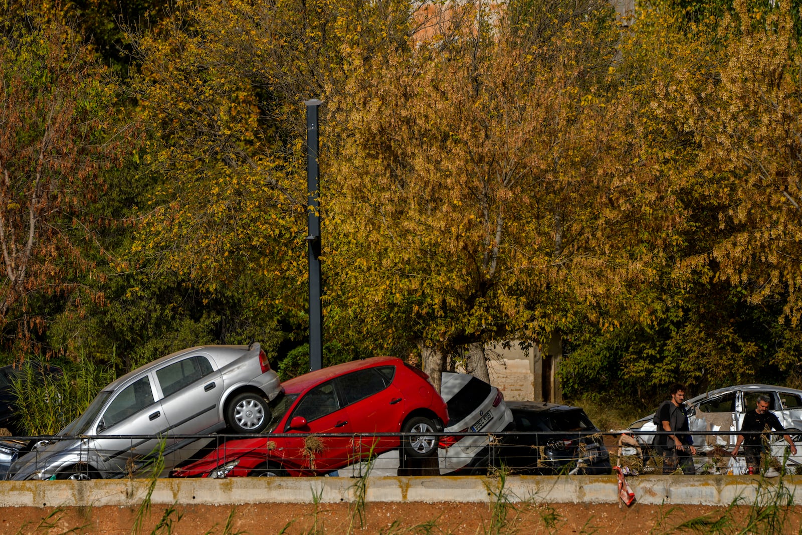 Flooded cars are piled up in Utiel, Spain, Wednesday, Oct. 30, 2024. (AP Photo/Manu Fernandez)