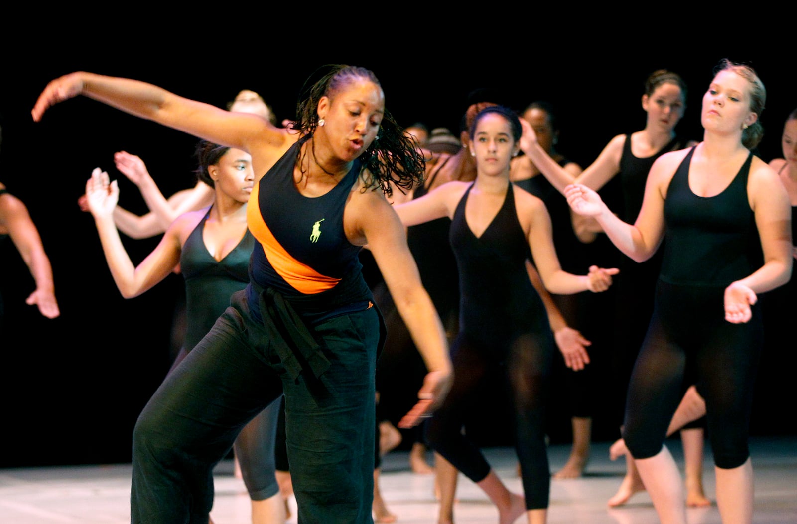 DeShona Pepper Robertson (left) teaches an advanced dance class during a summer immersion dance camp at Stivers School for the Arts in Dayton.  Seventy-five students are participating in the two-week camp which offers students a diverse sampling of a variety of dance. The camp will culminate in a performance for families Thursday June 26 at 2 p.m. The public is welcome to attend. Admission will be $1.    LISA POWELL / STAFF