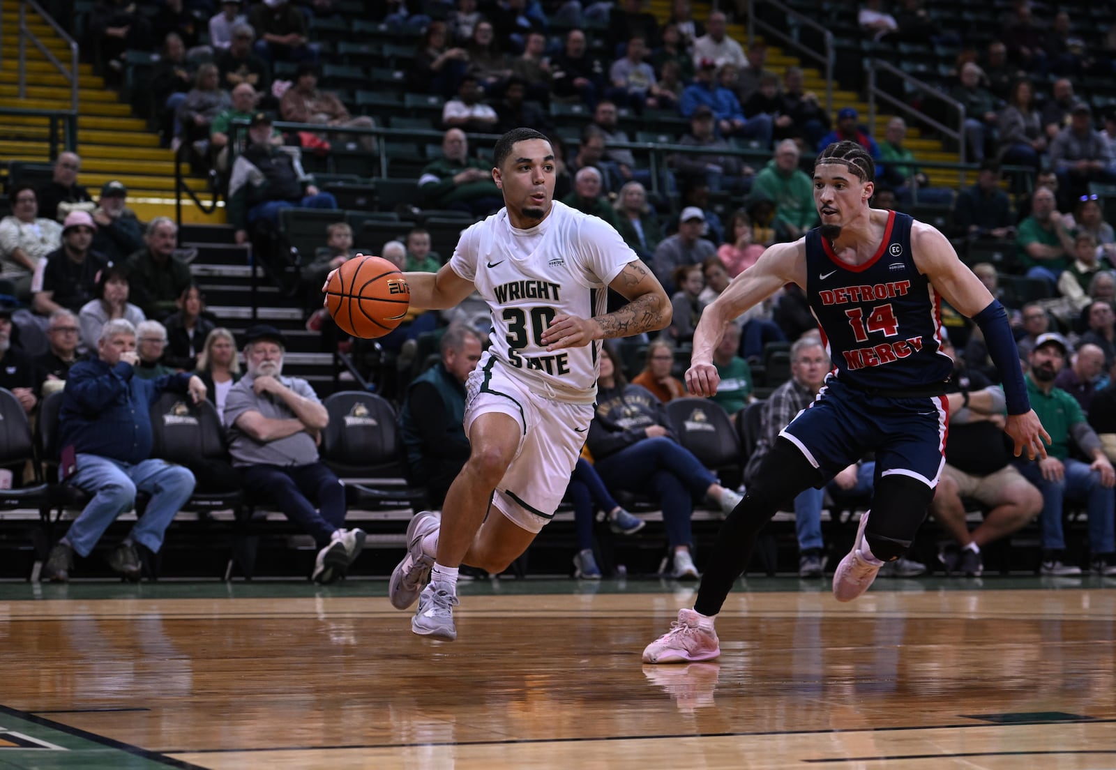 Wright State's Kaden Brown drives past Detroit Mercy's Jayden Stone during Thursday night's game at the Nutter Center. Joe Craven/Wright State Athletics