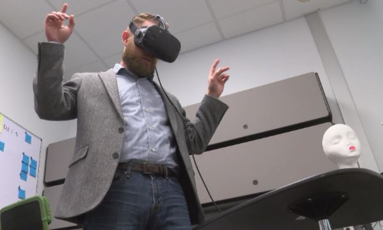 Vince Kilian, Marxent product development lead, uses a virtual reality headset. Virtual and augmented reality are being integrated into the shopping experience at many retailers, such as Macy's.