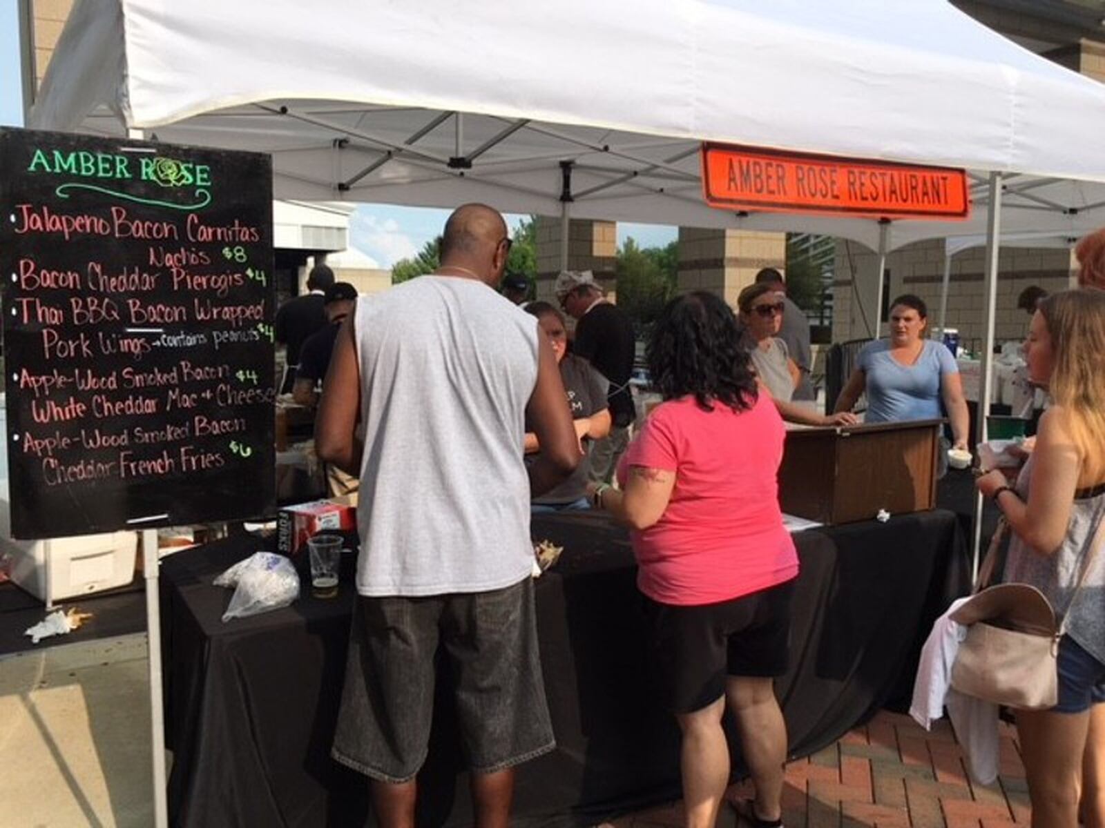 The annual Bacon Fest has been a popular summer event at Fraze Pavilion full of creative bacon-inspired dishes. TOM GILLIAM / CONTRIBUTED