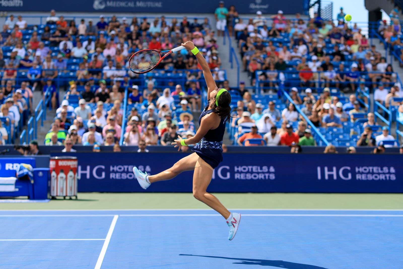 Caroline Garcia, of France, leaps as she attempts to return a shot against Petra Kvitova, of the Czech Republic, during the women's singles final of the Western & Southern Open tennis tournament, Sunday, Aug. 21, 2022, in Mason, Ohio. (AP Photo/Aaron Doster)