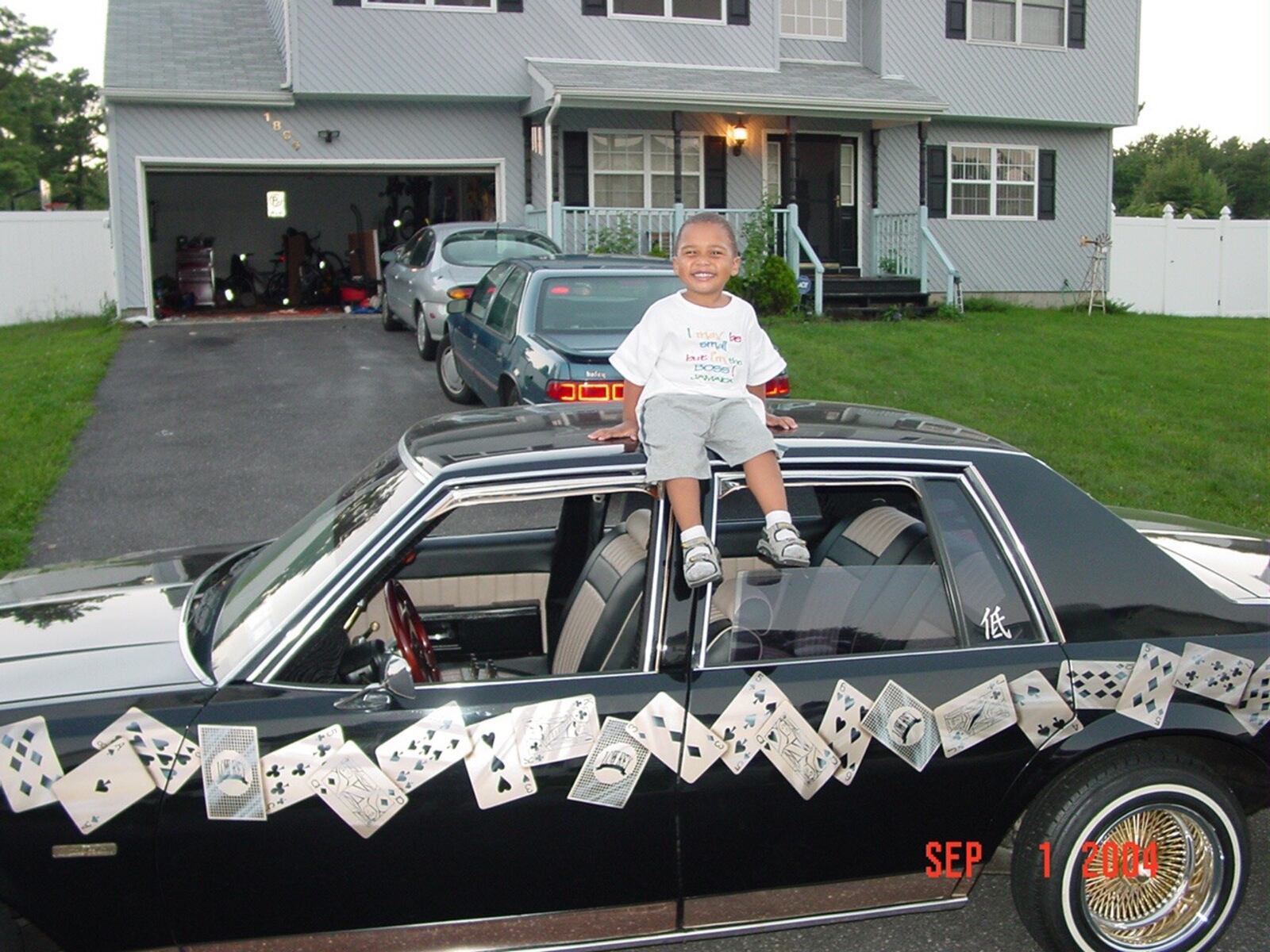 Two-year-old Zed Key sits on the roof of his dad’s lowrider, a 1979 Chevy Impala with its customized paint job. His dad has owned the car – dubbed the Key Player – 27 years and often displayed it at car shows. CONTRIBUTED