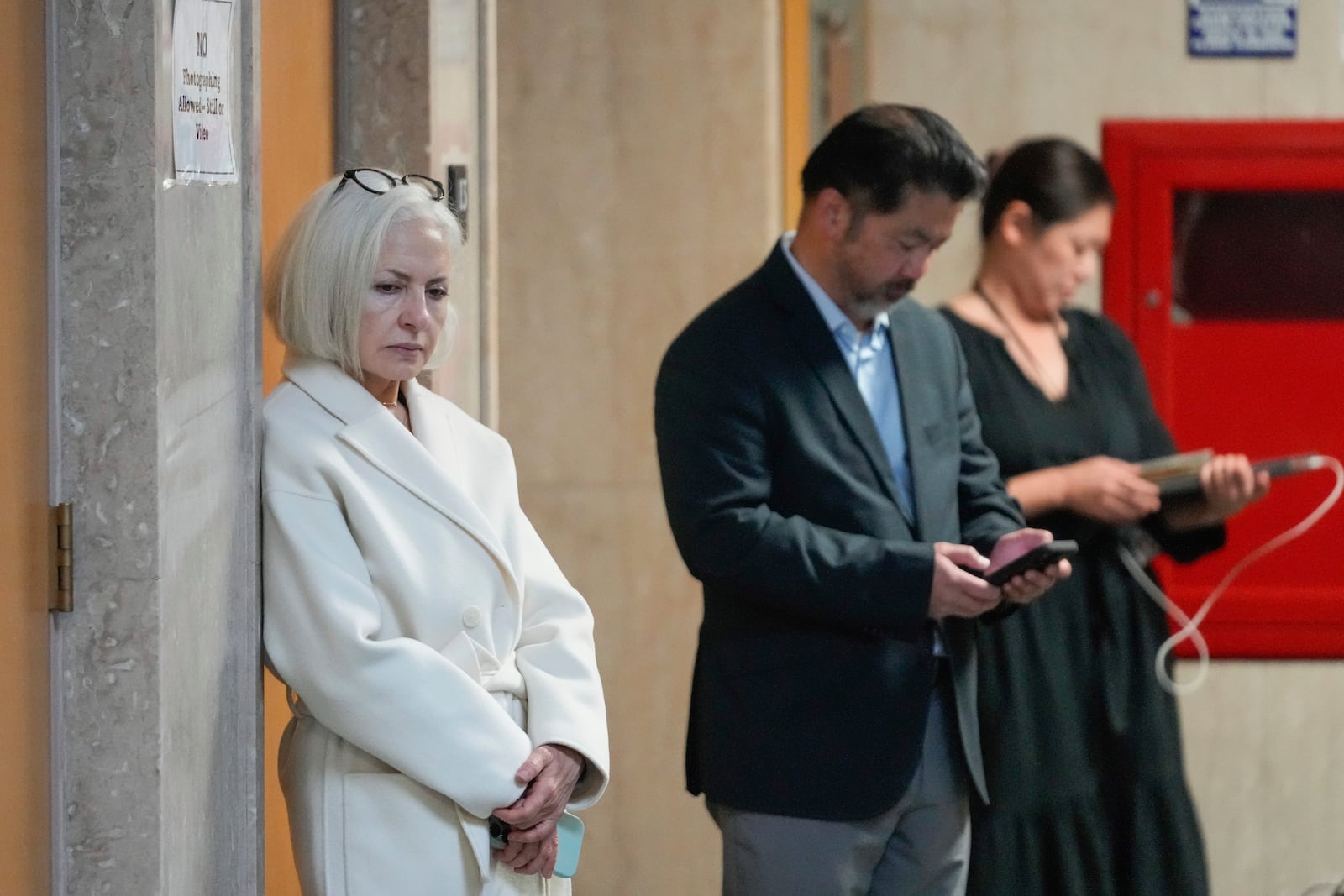 Mahnaz Tayarani, left, mother of Nima Momeni – who is charged with murder in Cash App founder Bob Lee's stabbing death – waits to enter the courtroom at the Hall of Justice for Momeni's murder trial Tuesday, Dec. 3, 2024, in San Francisco. (AP Photo/Godofredo A. Vásquez)