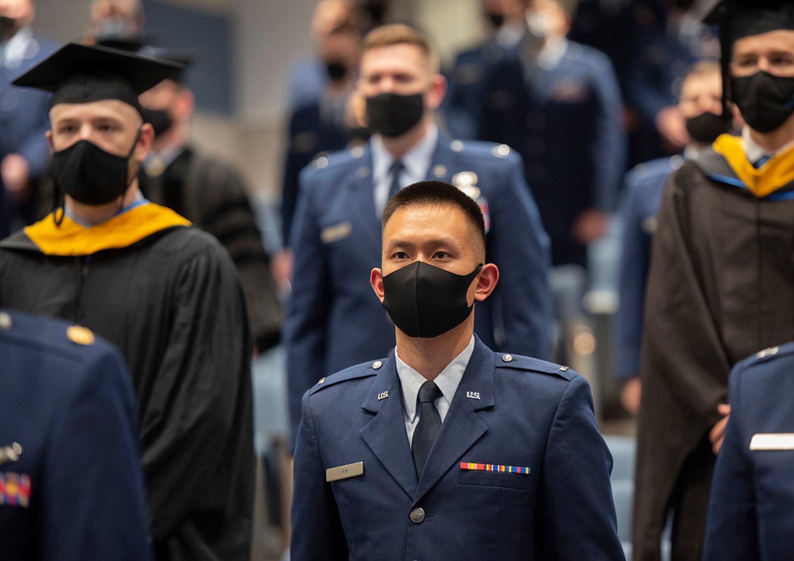 Second Lt. Benjamin Lam and his classmates take their seats at the start of the Air Force Institute of Technology graduation ceremony March 25 on Wright-Patterson Air Force Base. U.S. AIR FORCE PHOTO/R.J. ORIEZ