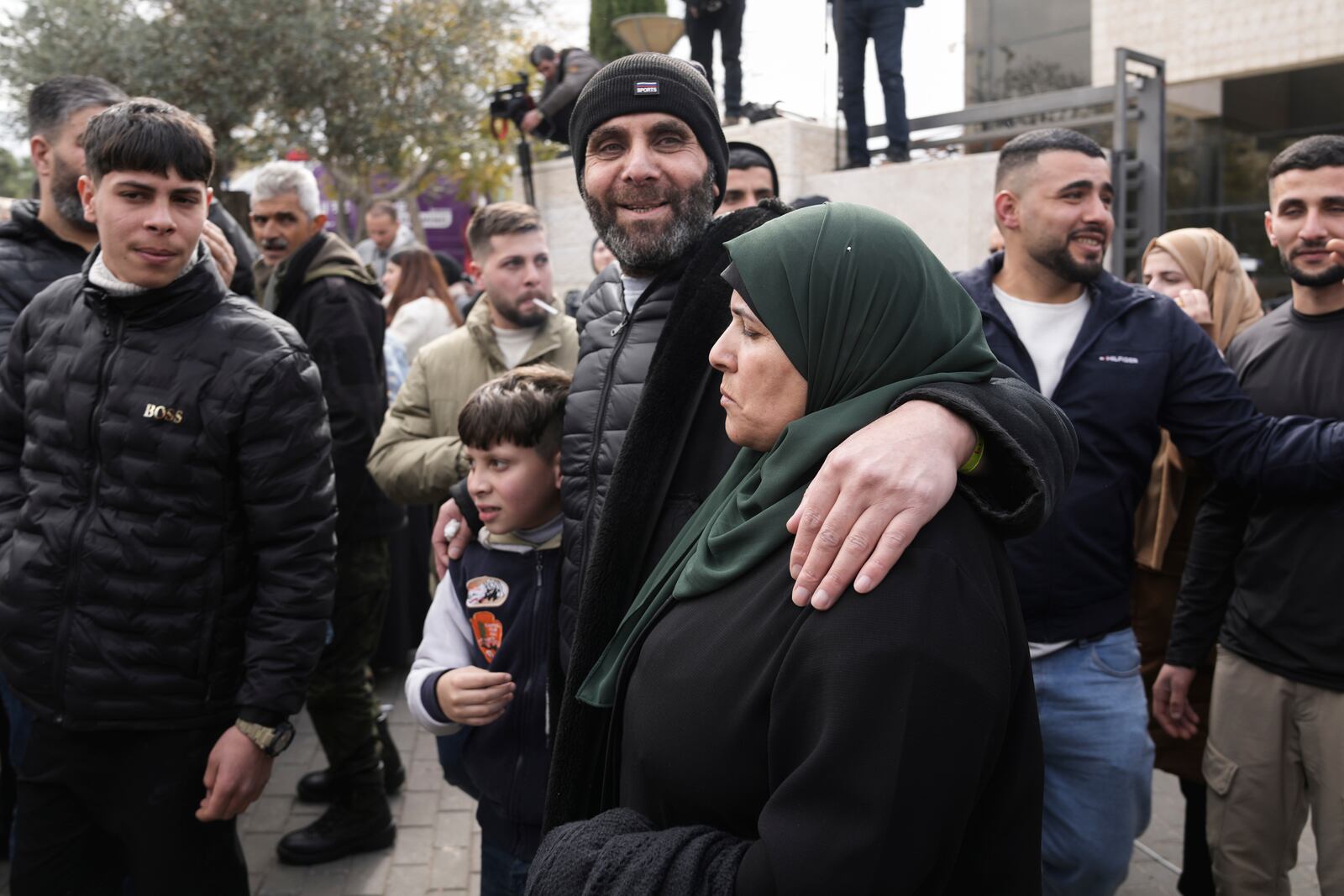 Palestinian prisoners are greeted after being released from Israeli prison following a ceasefire agreement between Israel and Hamas, in the West Bank city of Ramallah, Saturday Feb. 8, 2025. (AP Photo/Mahmoud Illean)