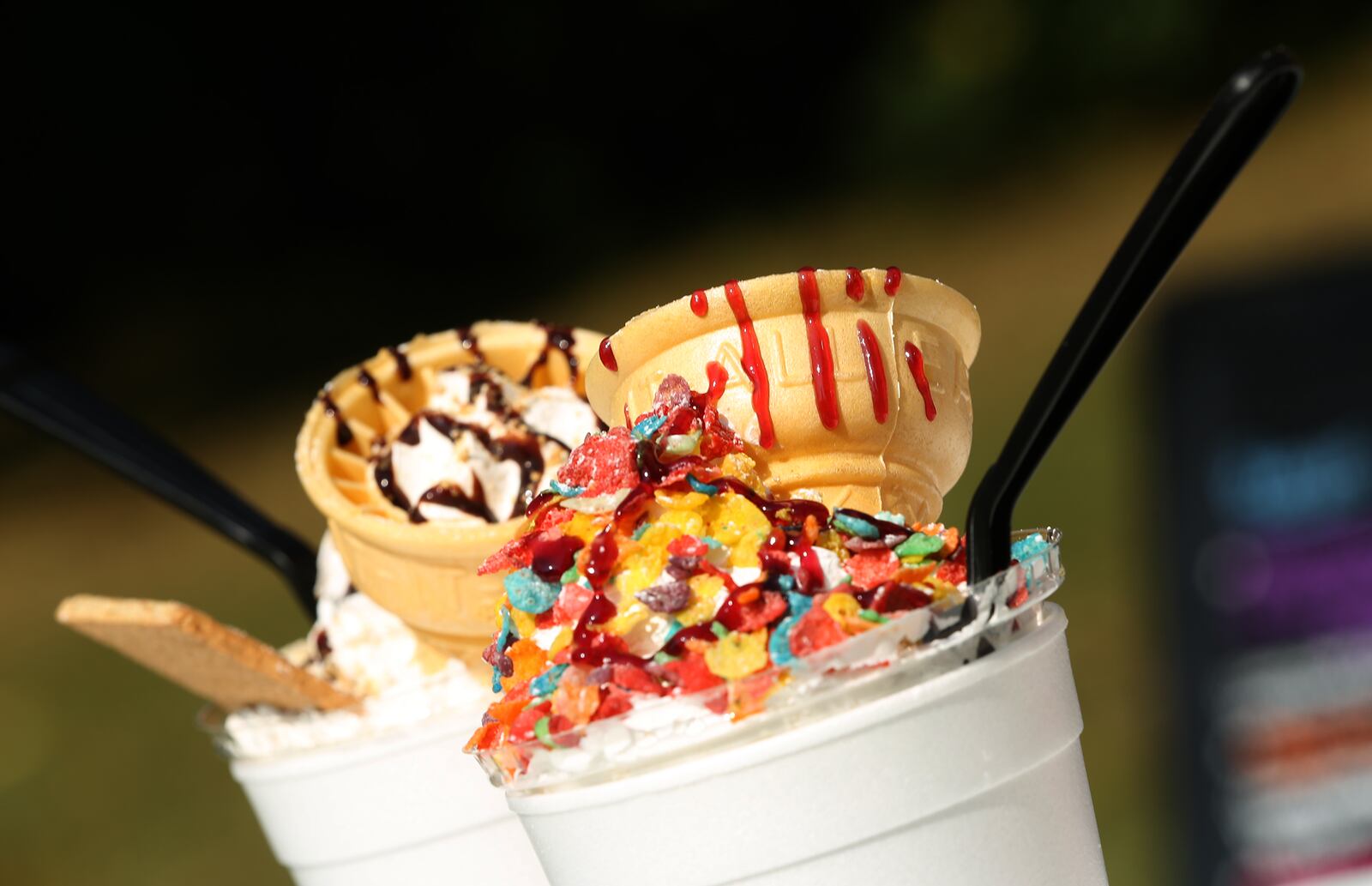 The Rolling Indulgence food truck S'mores Mashup shake (left) is made with vanilla bean ice cream, graham cracker crumbs, fudge sauce, whipped cream, powdered sugar and chocolate sauce. The Fruity Pebbles shake is made with vanilla bean ice cream, Fruity Pebbles, raspberry sauce, powdered sugar and heavy cream. LISA POWELL / STAFF