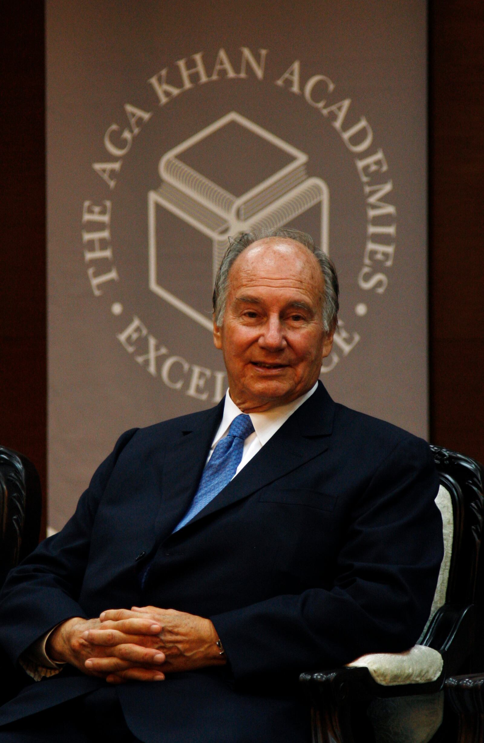 FILE - The Aga Khan, spiritual head of Ismaili Muslims, listens to a speech during the inauguration of the Aga Khan Academy in Hyderabad, India, Friday, Sept. 20, 2013. (AP Photo/Mahesh Kumar A., File)