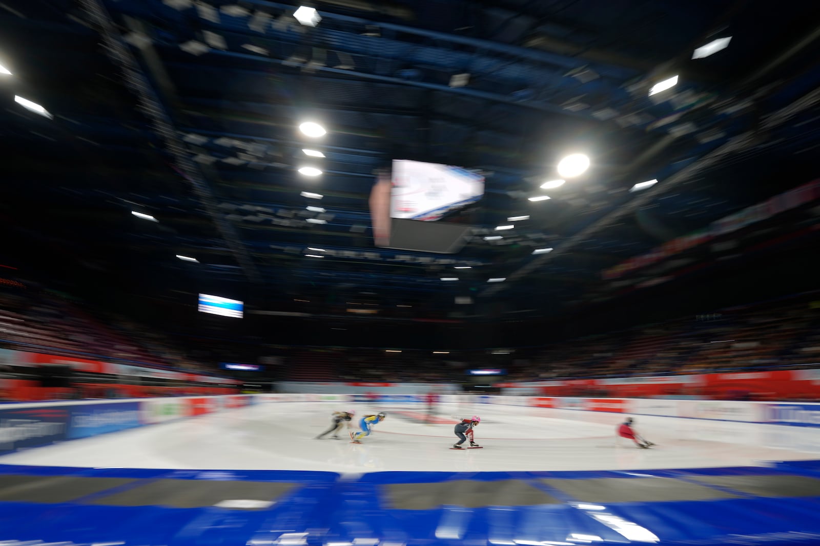 Athletes compete during men's preliminaries round of the ISU Short Track World Tour, Olympics Milano-Cortina 2026 test event, in Milan, Italy, Friday, Feb. 14, 2025. (AP Photo/Luca Bruno)