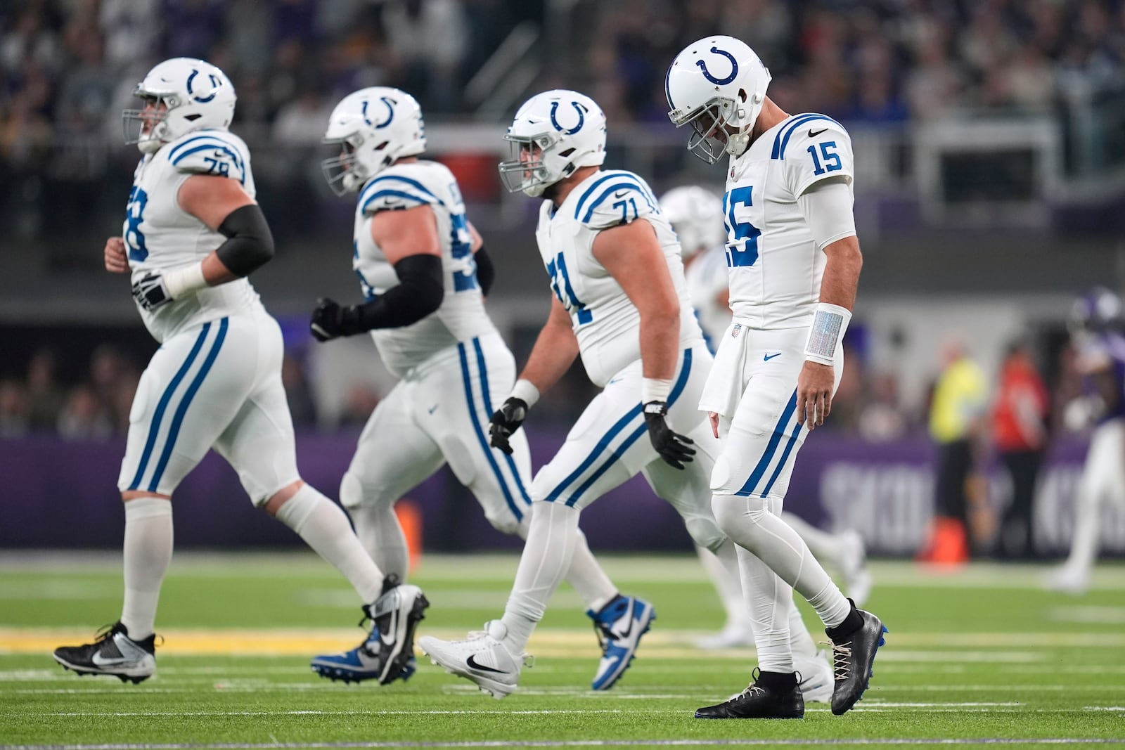 Indianapolis Colts quarterback Joe Flacco (15) walks off the field after throwing an incomplete pass during the first half of an NFL football game against the Minnesota Vikings, Sunday, Nov. 3, 2024, in Minneapolis. (AP Photo/Abbie Parr)