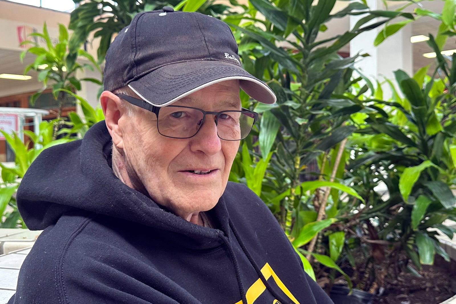 Wayne Shaw, 80, ia mechanical engineer, who supports Elon Musk's effort to sharply cut the federal workforce, poses for a photo Feb. 6, 2025, in Urbandale, Iowa. (AP Photo/Thomas Beaumont)