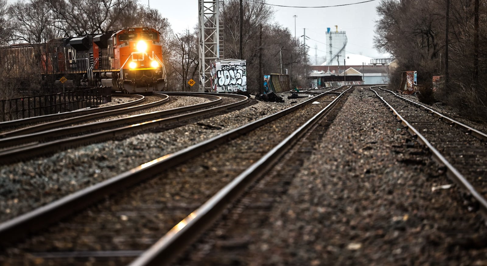 A Canadian National Railway freight train rolls through the heart of Dayton Wednesday February 22, 2023. JIM NOELKER/STAFF