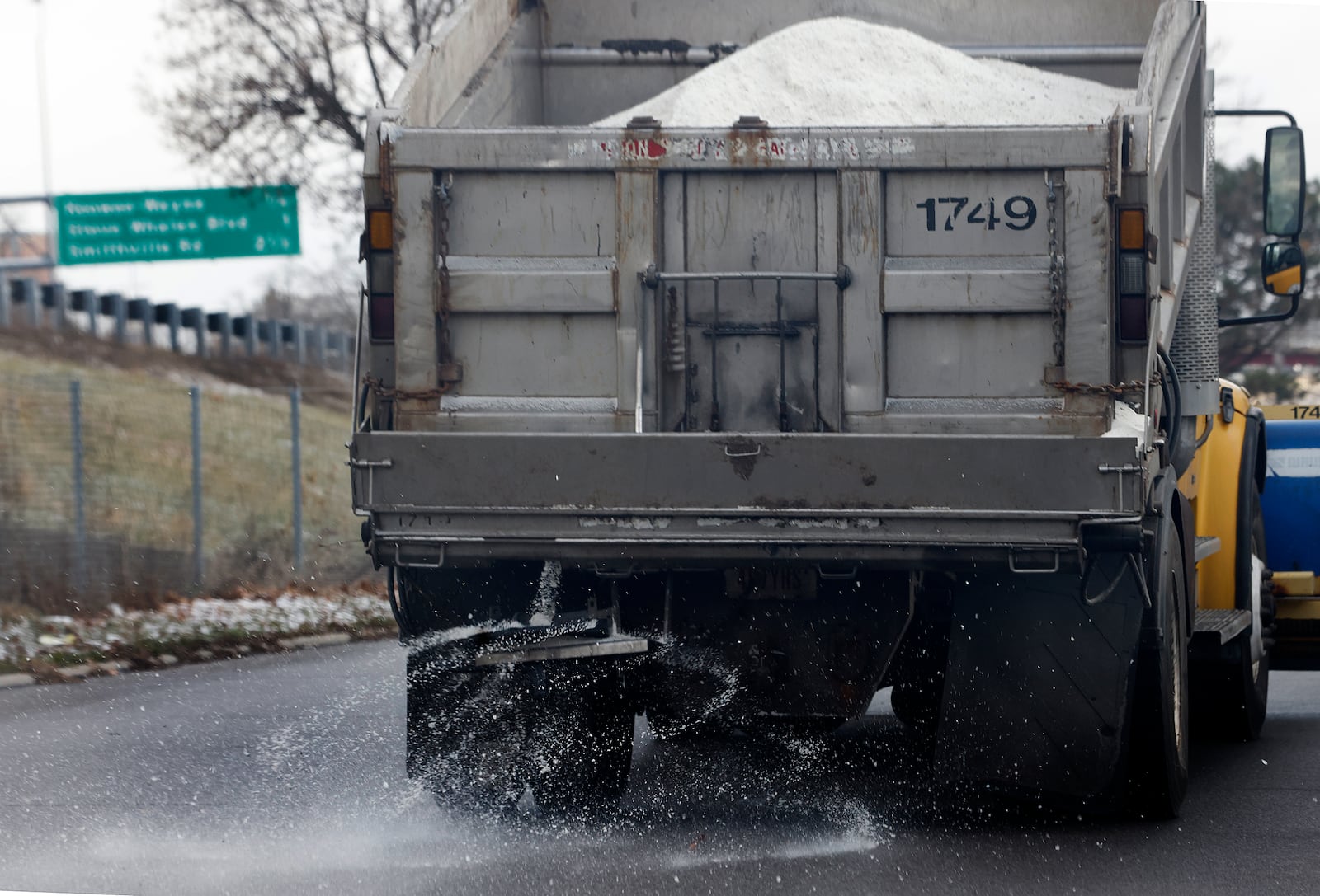 A city of Dayton salt truck makes a run down Buckeye Street, Friday, Jan. 3, 2024, in preparation for the upcoming snowfall. MARSHALL GORBY\STAFF