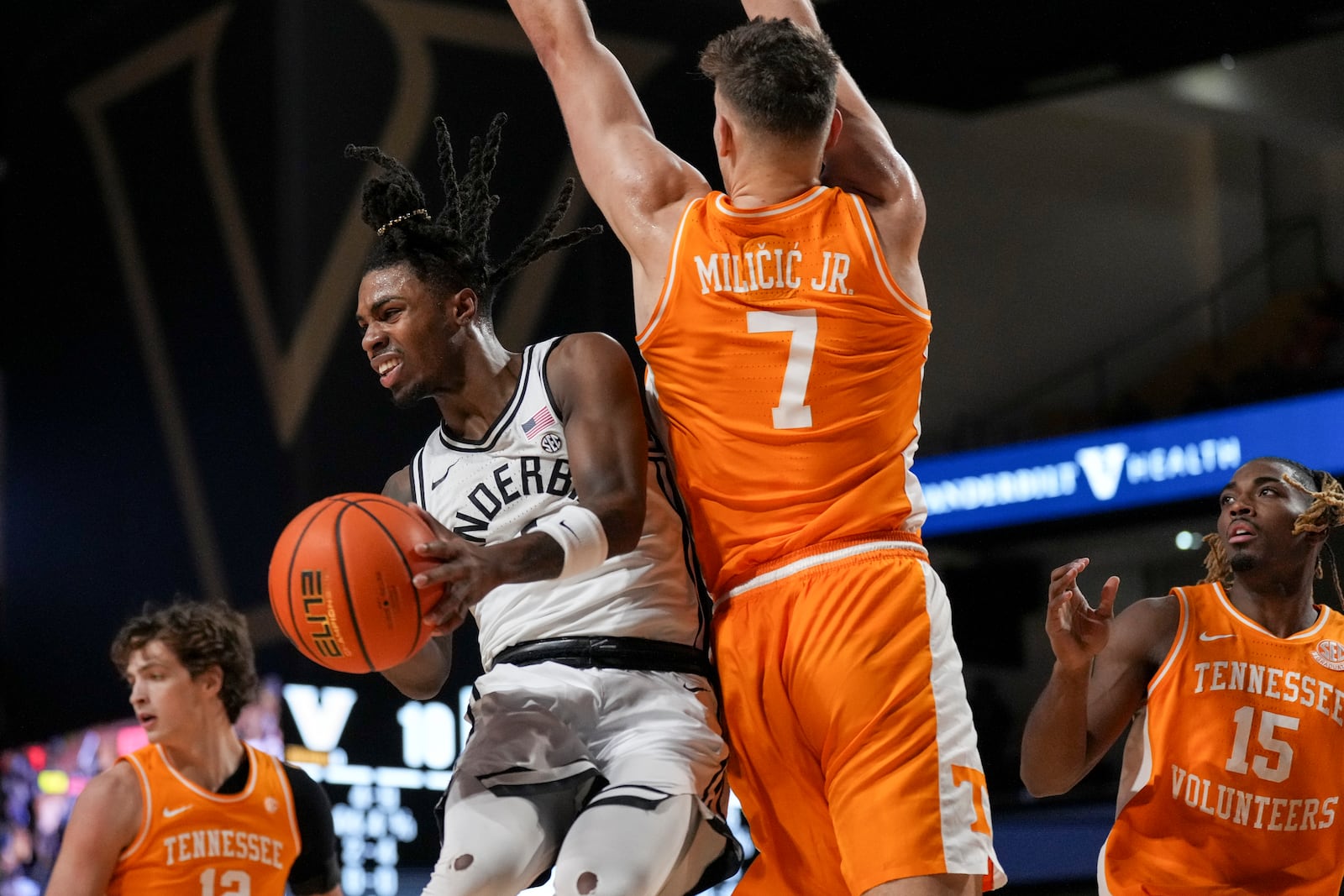 Vanderbilt guard Jason Edwards, left, passes the ball away from Tennessee forward Igor Milicic Jr. (7) during the first half of an NCAA college basketball game Saturday, Jan. 18, 2025 in Nashville, Tenn. (AP Photo/George Walker IV)