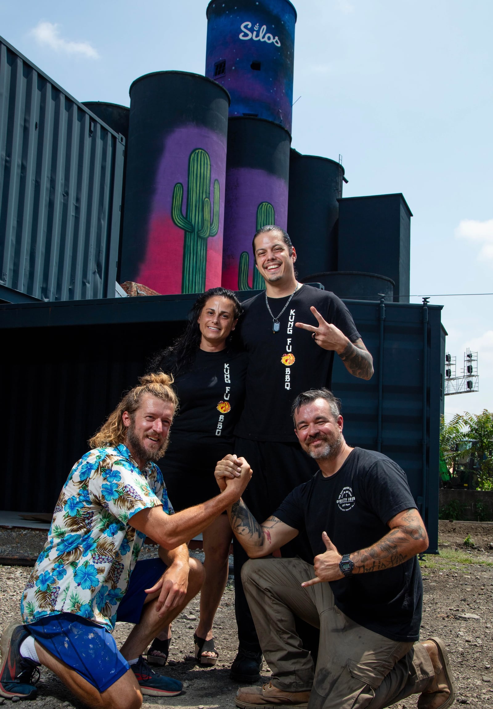 KungFu BBQ will serve worldly-inspired cuisine with a unique smoked interpretation at The Silos, a new food hall and beer garden expected to open in the fall near 2nd Street Market in downtown Dayton. Pictured are KungFu BBQ owners Marie and Nate Lansangan with Wes Hartshorn and Shannon Thomas, who own The Silos (CONTRIBUTED PHOTO).