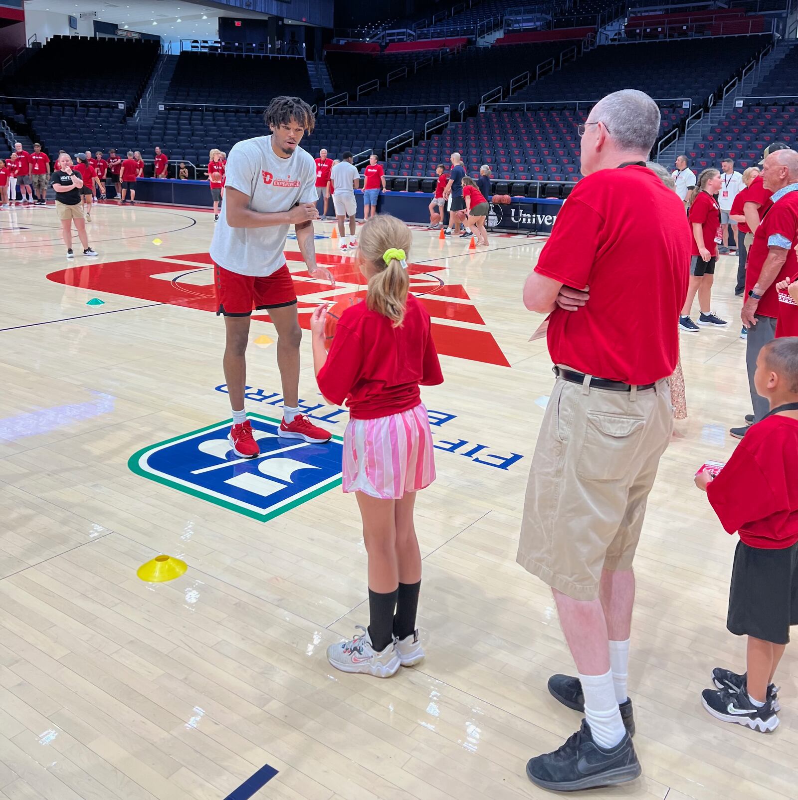 Dayton's DaRon Holmes II works with kids at a basketball camp at UD Arena. Contributed photo