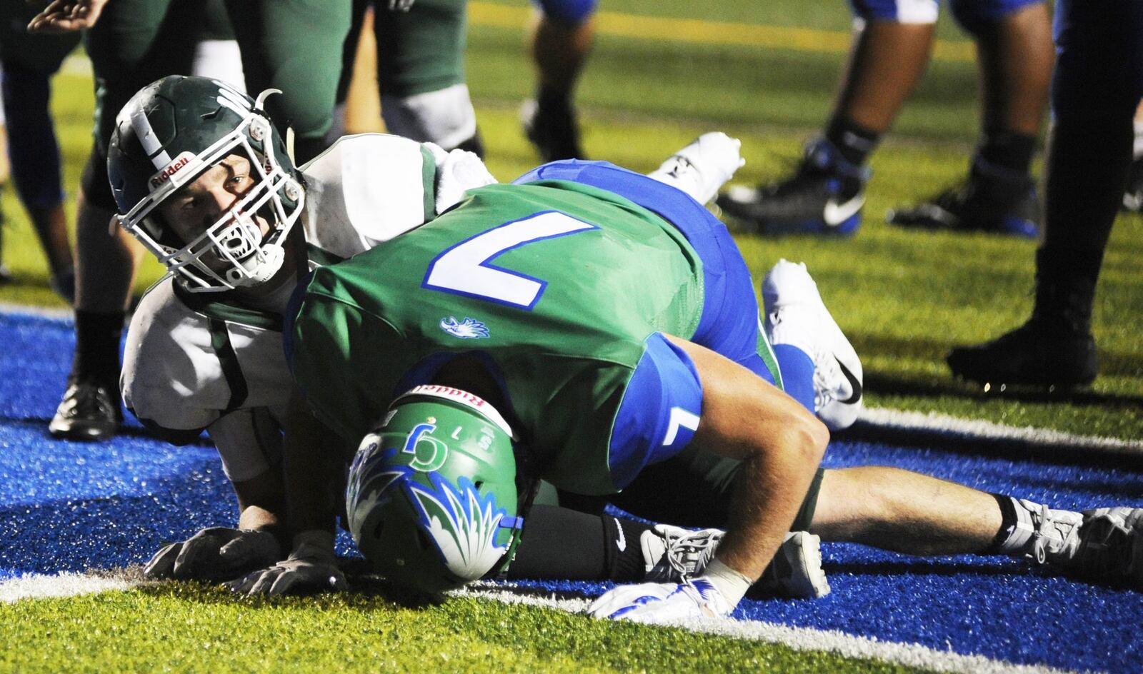 Greenville’s Landon Eldridge (left) scores over CJ’s Brendan Kadel. Chaminade Julienne defeated visiting Greenville 58-16 in a Week 3 high school football game on Thursday, Sept. 6, 2018. MARC PENDLETON / STAFF