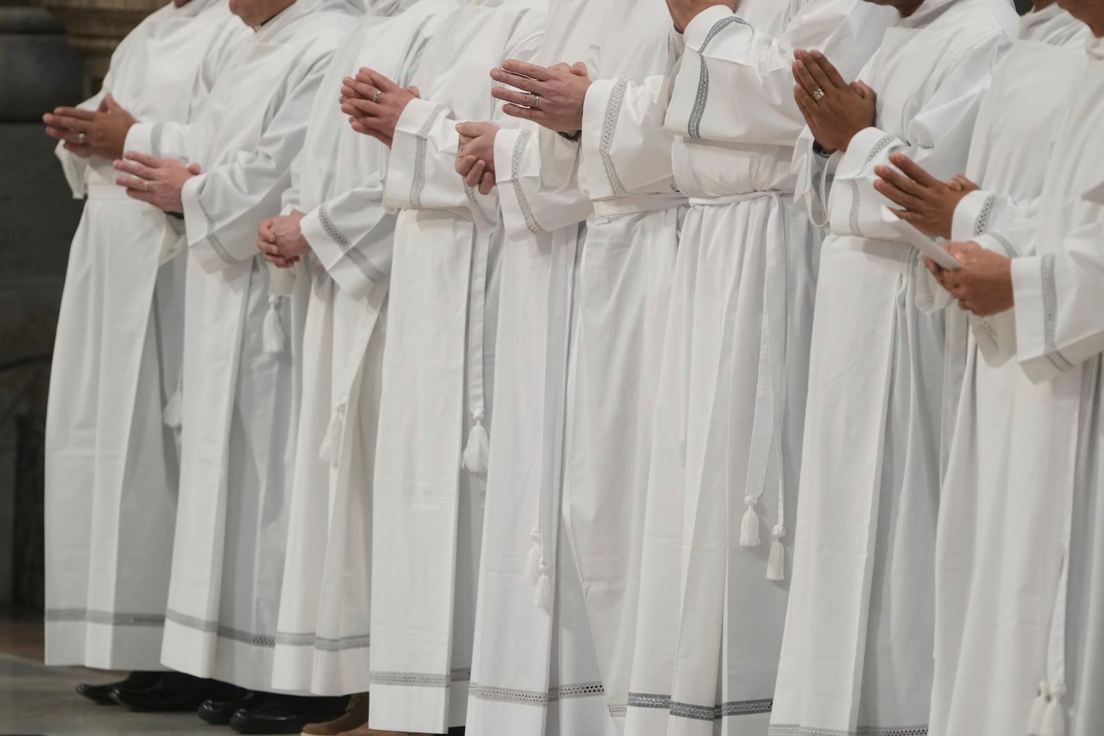 Deacons take part in a mass for their jubilee in St. Peter's Basilica at The Vatican that was supposed to be presided over by Pope Francis who was admitted over a week ago at Rome's Agostino Gemelli Polyclinic and is in critical conditions. (AP Photo/Alessandra Tarantino)