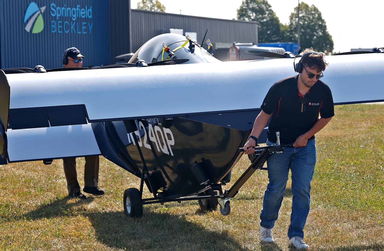 Tristan Giardullo, from Sinclair, pulls one of the PIVOTAL Blackfly UAV's into place for a demonstration flight Monday, Sept. 9, 2024. BILL LACKEY/STAFF