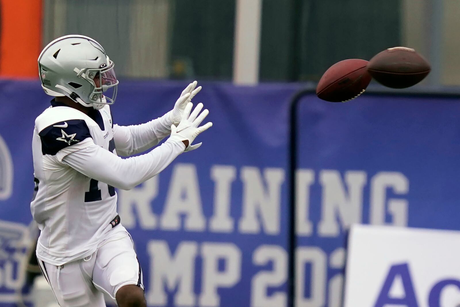 Dallas Cowboys wide receiver Aaron Parker (18) reaches for pass during an NFL training camp football practice in Frisco, Texas, Thursday, Sept. 3, 2020. (AP Photo/LM Otero)