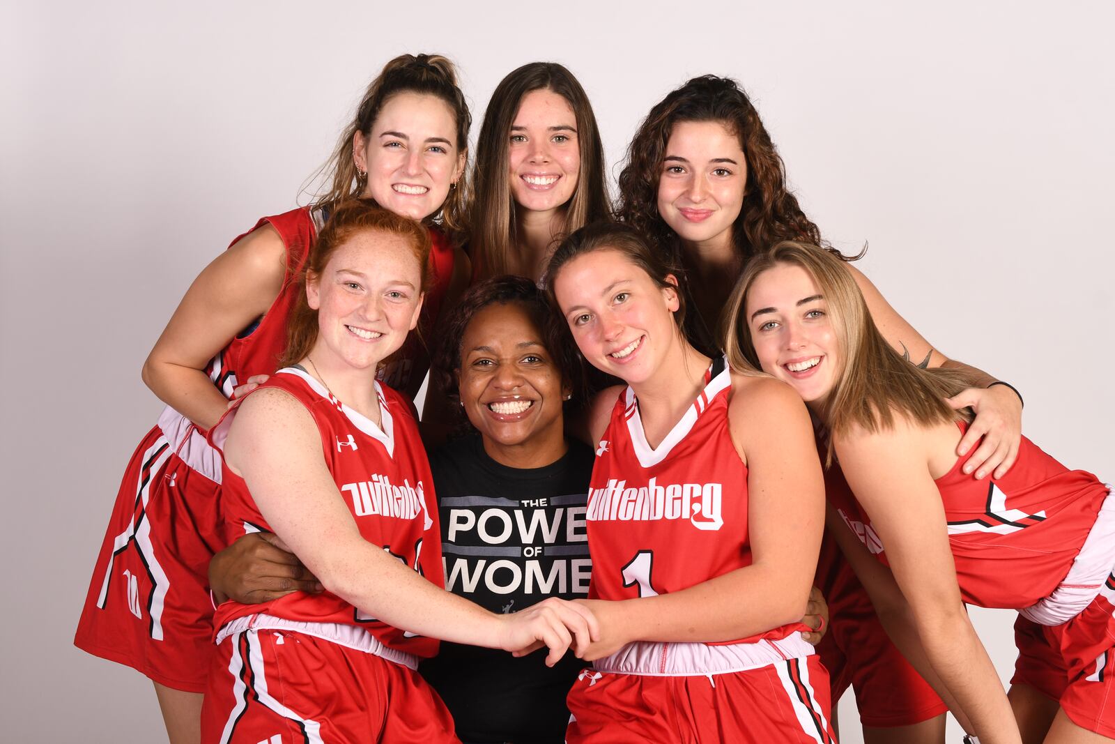 Wittenberg women's basketball coach Tamika Williams-Jeter (center) with some of her players on picture day. Wittenberg Athletics photo