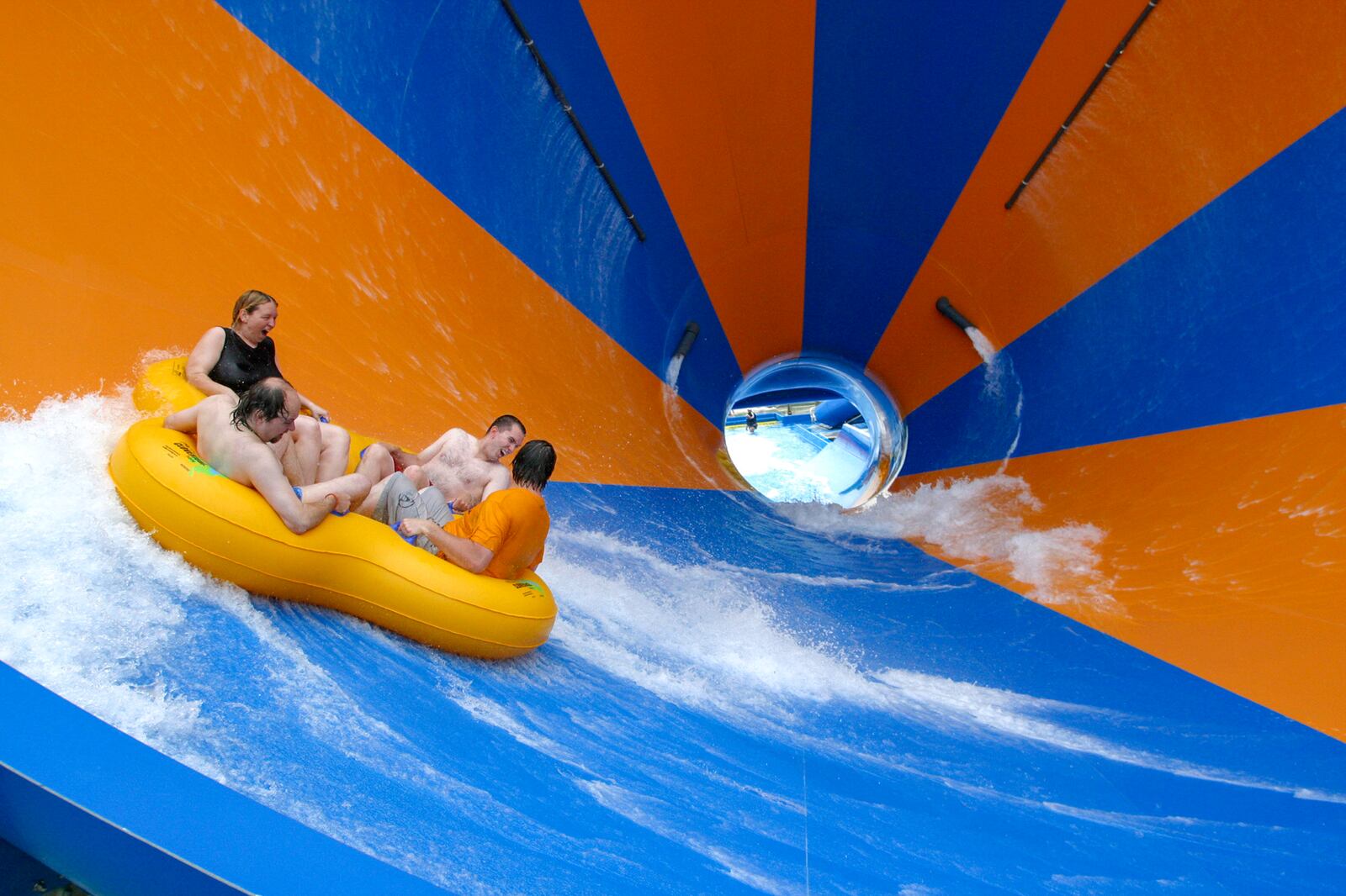 Riders on the Tasmanian Typhoon scream as they slide up the wall of a giant funnel after a ride through a dark tunnel in Crocodile Dundee's Boomerang Bay Water Park Resort at Parmount's Kings Island.  Ty Greenlees/DDN