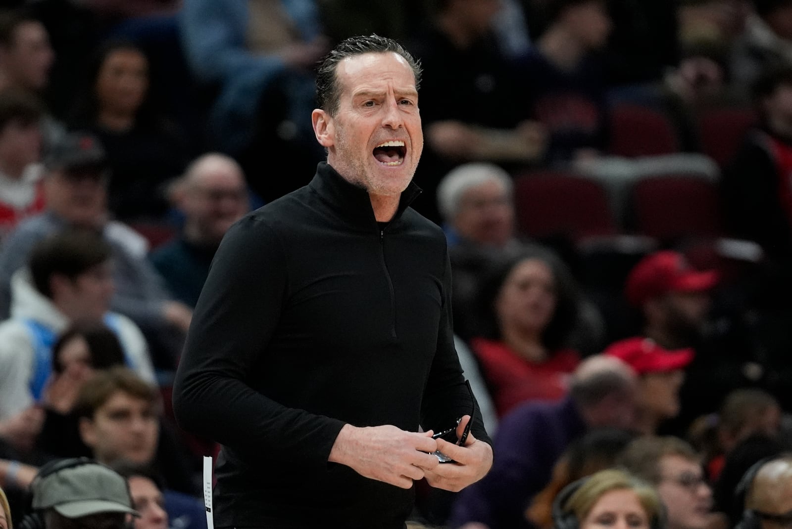 Cleveland Cavaliers head coach Kenny Atkinson shouts from the bench during the first half of an NBA basketball game against the Chicago Bulls, Tuesday, March 4, 2025, in Chicago. (AP Photo/Erin Hooley)