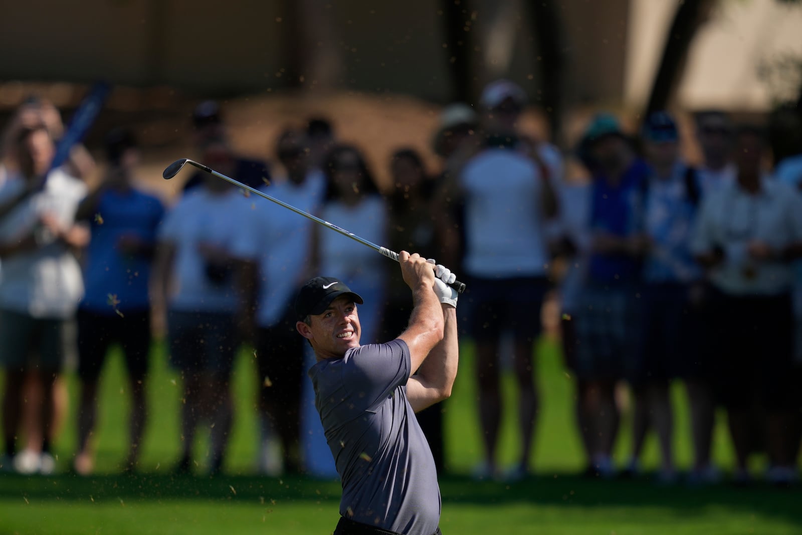 Rory McIlroy of Northern Ireland plays his second shot on the 2nd hole during the second round of World Tour Golf Championship in Dubai, United Arab Emirates, Friday, Nov. 15, 2024. (AP Photo/Altaf Qadri)