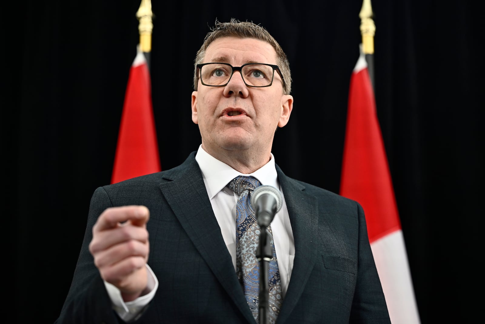 Saskatchewan Premier Scott Moe speaks as he arrives for a first ministers meeting in Ottawa on Wednesday, Jan. 15, 2025. (Justin Tang/The Canadian Press via AP)