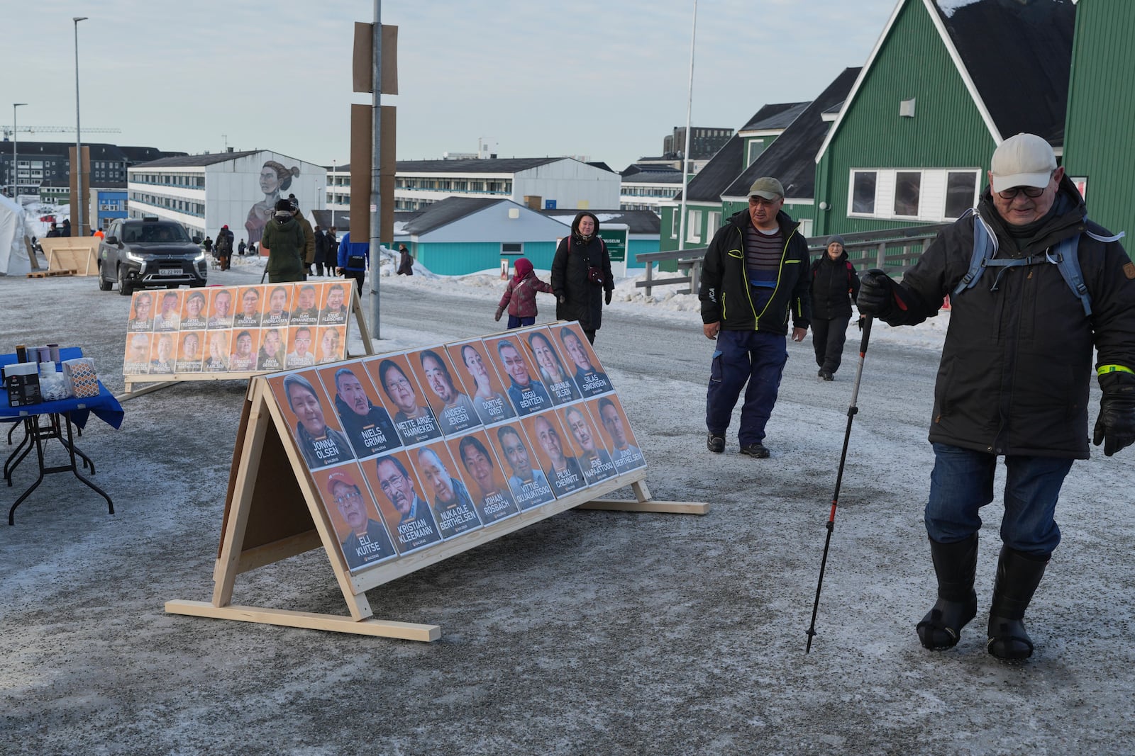 People arrive at a polling station to cast their vote in parliamentary elections, in Nuuk, Greenland, Tuesday, March 11, 2025. (AP Photo/Evgeniy Maloletka)