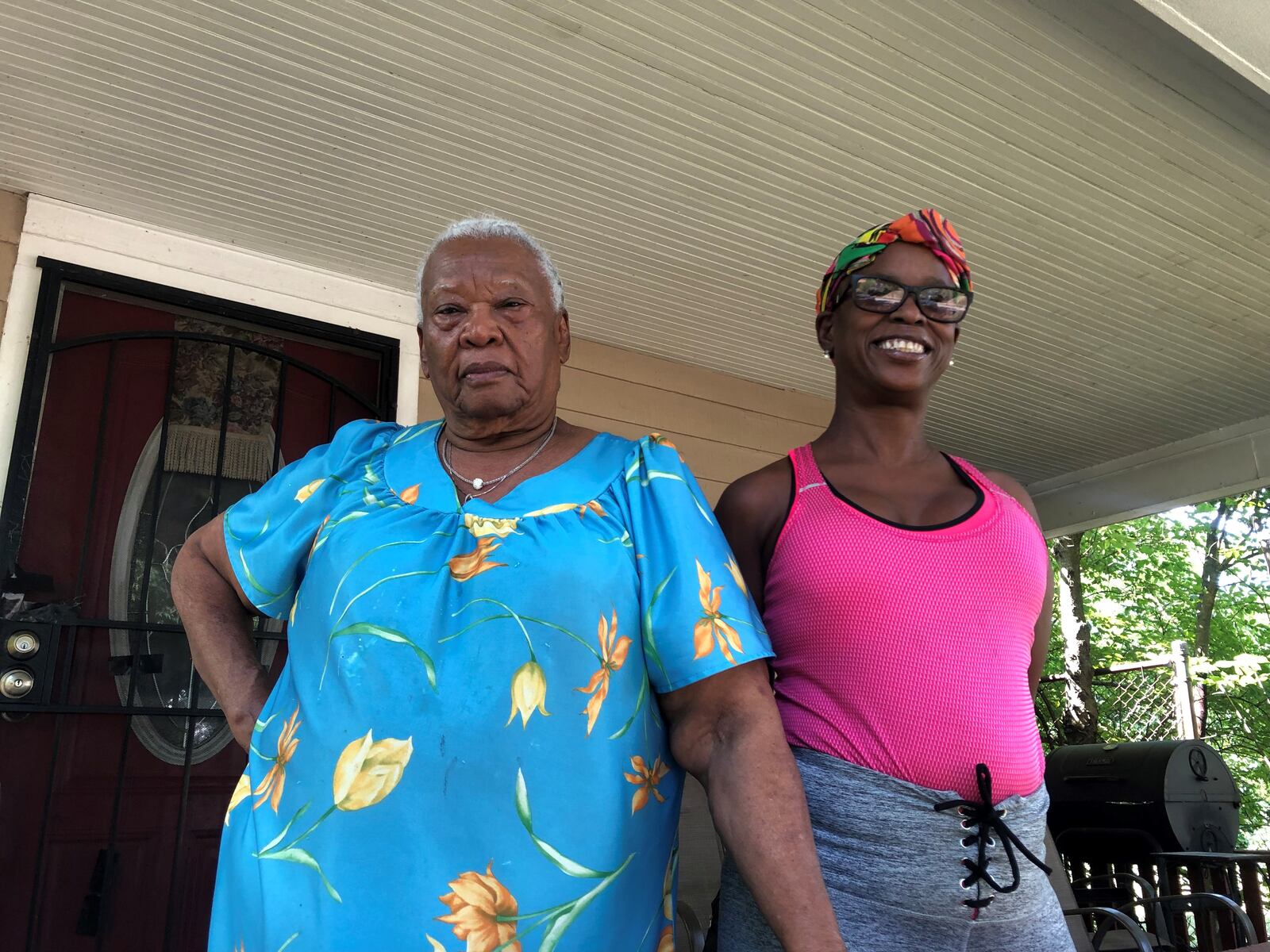 Velma Morning, 87, and Angela Glover, 55, on the porch of their home on Oxford Avenue. They say their neighborhood is full of vacant homes that attract drug activities and illegal dumping. CORNELIUS FROLIK / STAFF