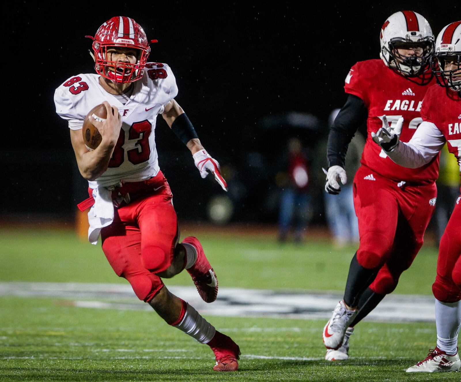 Fairfield's Erick All carries the ball on a fake punt for a touchdown during their Division I playoff football game against Milford in 2018. NICK GRAHAM/STAFF