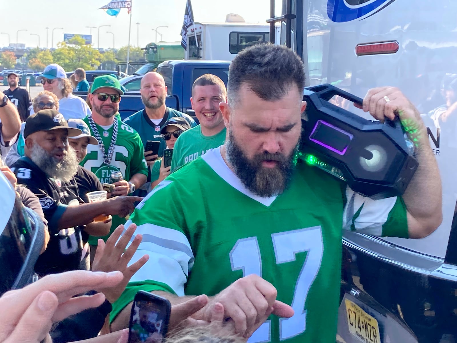 Retired Philadelphia Eagles center Jason Kelce greets fans at an impromptu appearance at a pregame tailgate party of an NFL football game between the Philadelphia Eagles and the Cleveland Browns, Sunday, Oct. 13, 2024 in Philadelphia. (AP Photo/Dan Gelston)