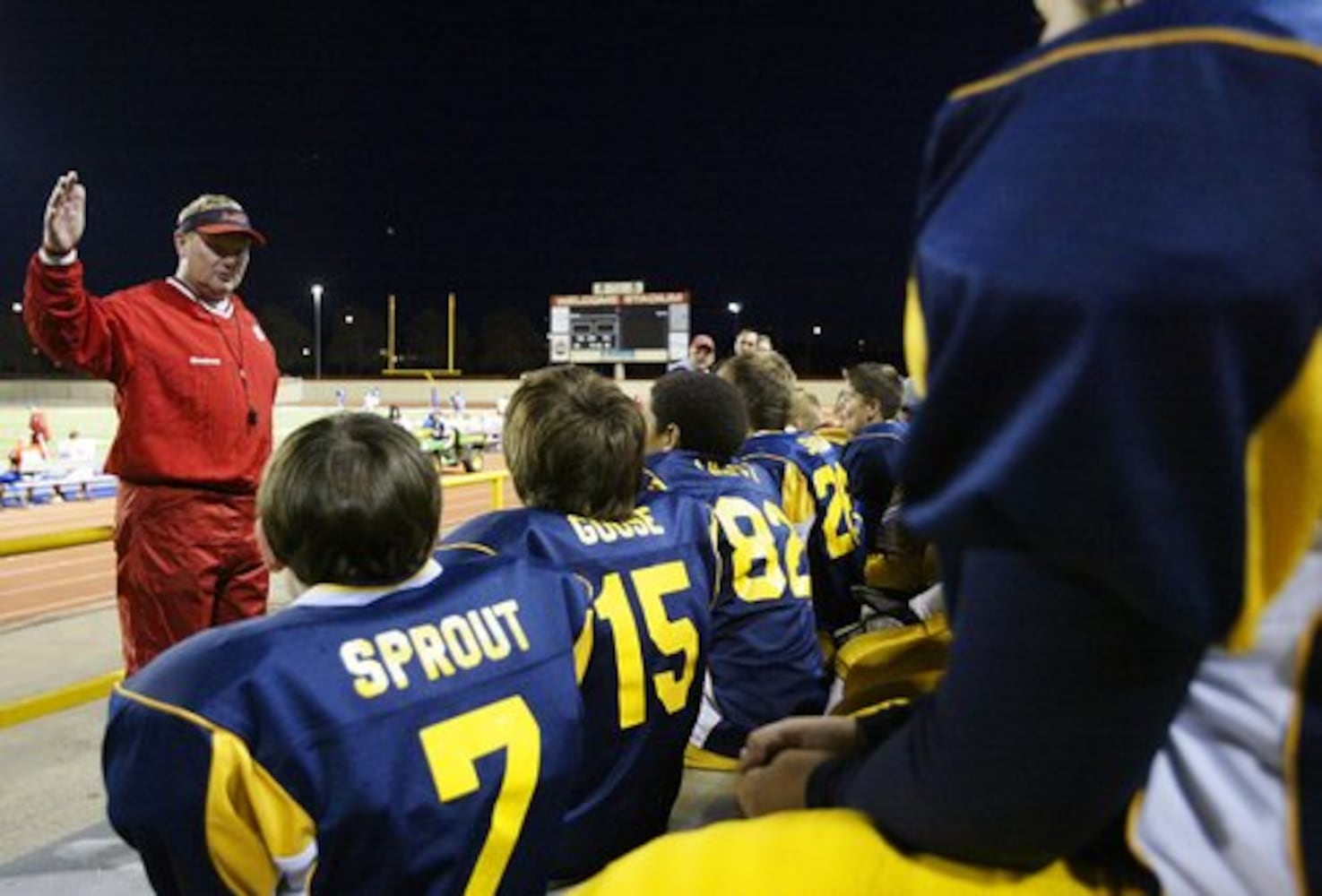 Youth football team visits UD Flyers