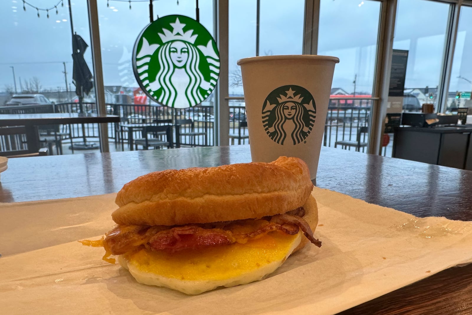 A double-smoked bacon, cheddar & egg sandwich from the Starbucks All-Day Breakfast menu is pictured in Streetsboro, Ohio, Wednesday, Feb. 12, 2025. (AP Photo/Sue Ogrocki)