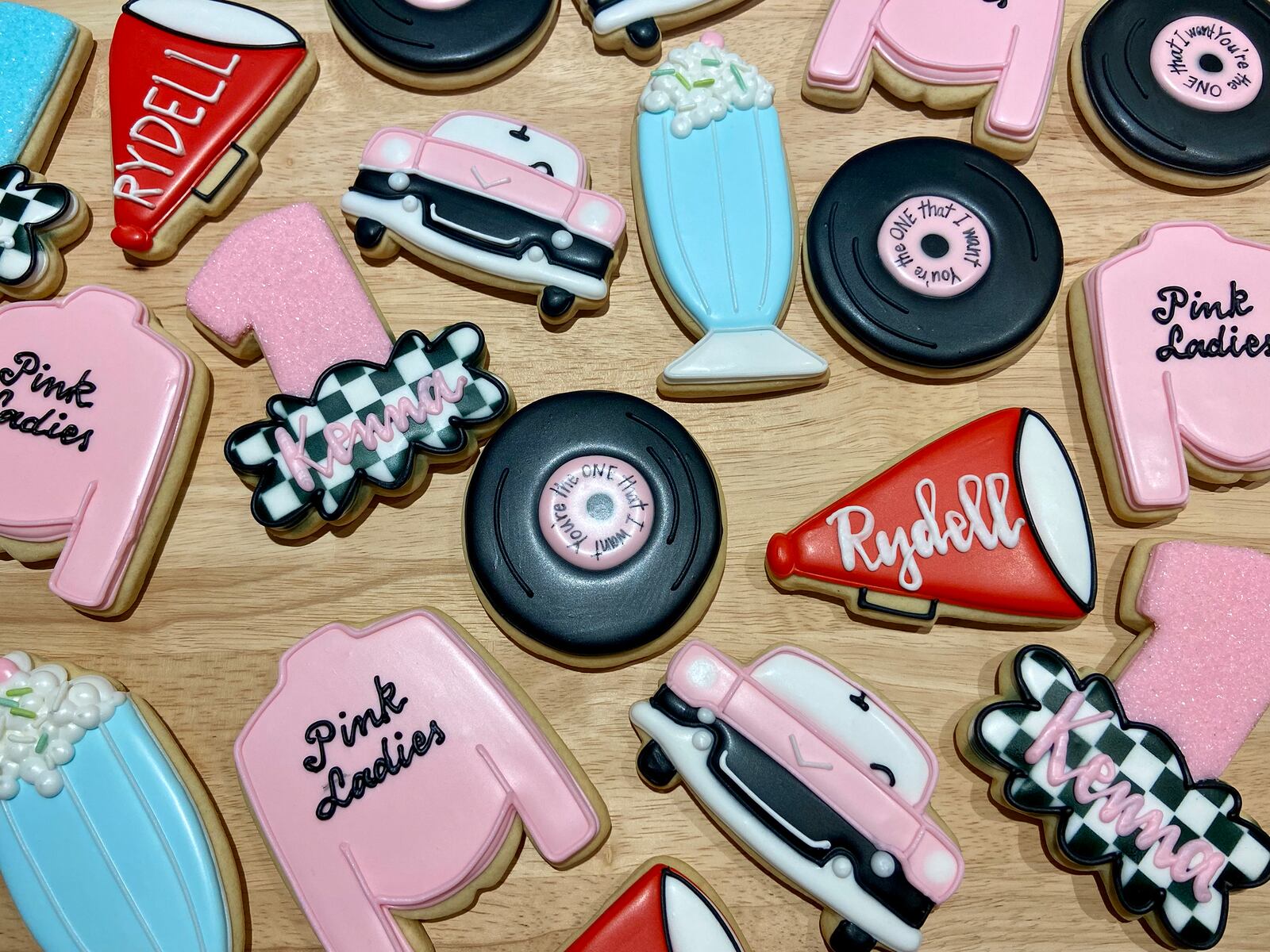 Cookies for a first birthday party with a Grease/Pink Lady theme. Robbins has continued to refine her techniques over the years and now takes custom orders only.