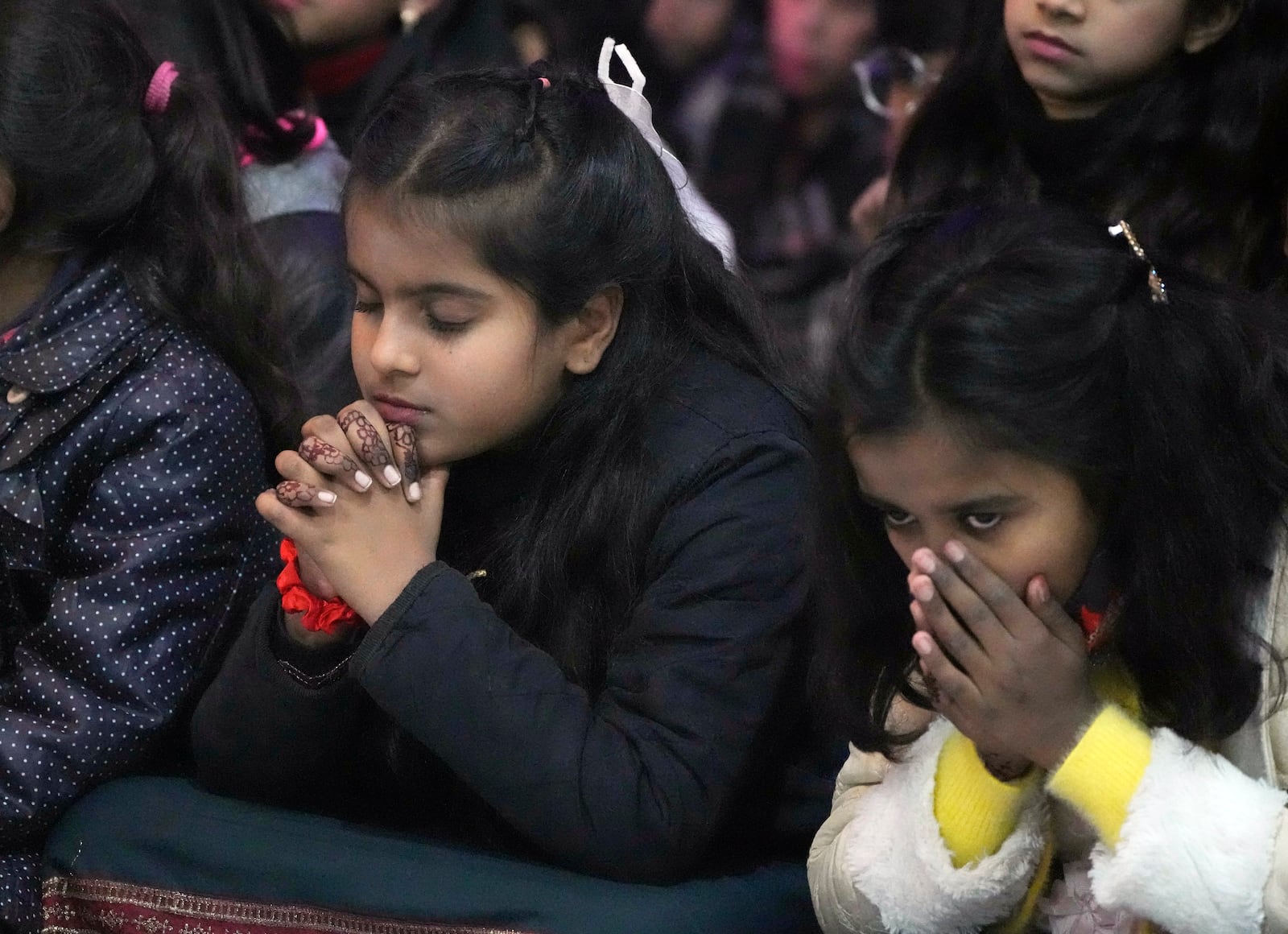 Pakistani Christians attend midnight Christmas Mass at St. Anthony's church in Lahore, Pakistan, Wednesday, Dec. 25, 2024. (AP Photo/K.M. Chaudary)