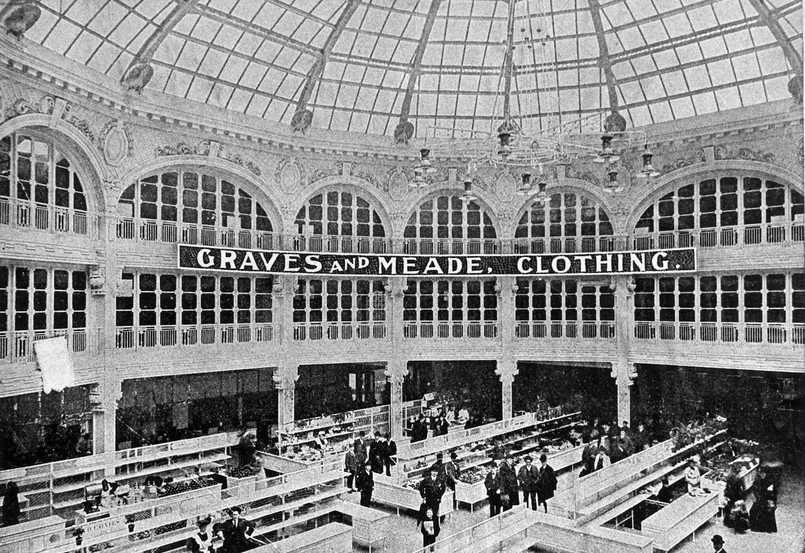 This early photograph of the Dayton Arcade shows shopping stalls and shoppers in the rotunda. The building, which opened in 1904, was designed to house shops and farmers markets on the first floor while offices and apartments were located above. DAYTON DAILY NEWS / WRIGHT STATE UNIVERSITY ARCHIVE AND SPECIAL COLLECTIONS