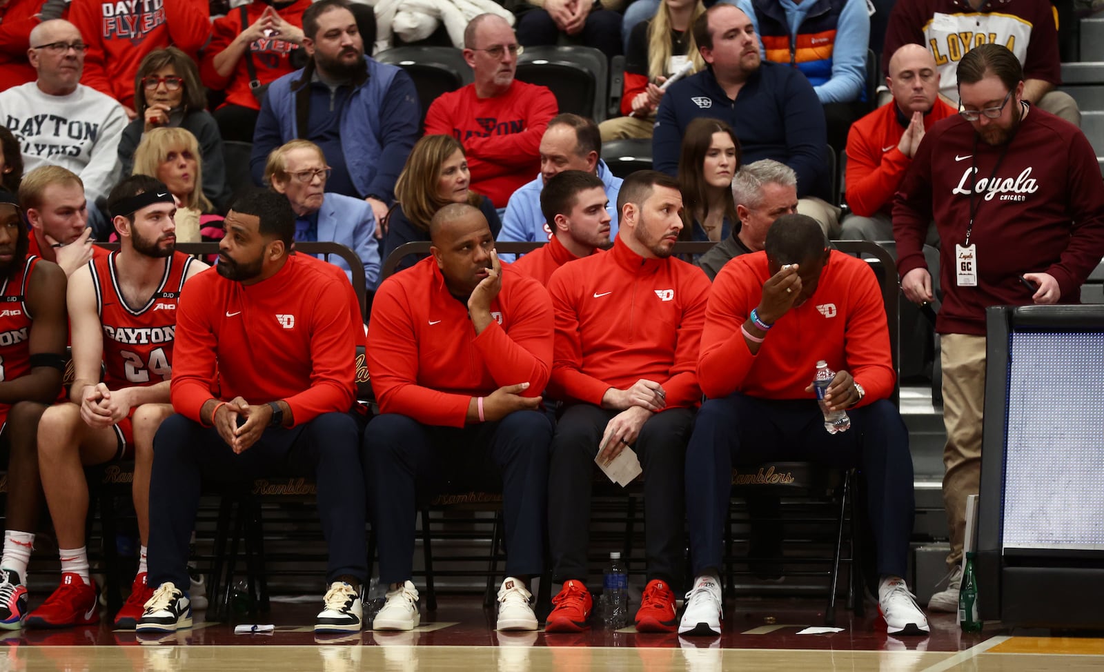 Dayton's Anthony Grant, right, reacts to a play in the second half against Loyola Chicago on Friday, Feb. 21, 2025, at Gentile Arena in Chicago. David Jablonski/Staff