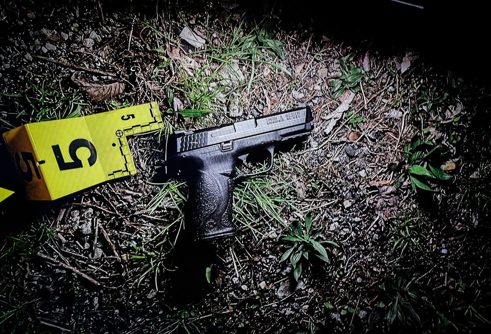 Dayton Police found a gun at the scene of a police shooting in April 2023. Police believe the gun was in the possession of a man who was shot by police. JIM NOELKER/STAFF