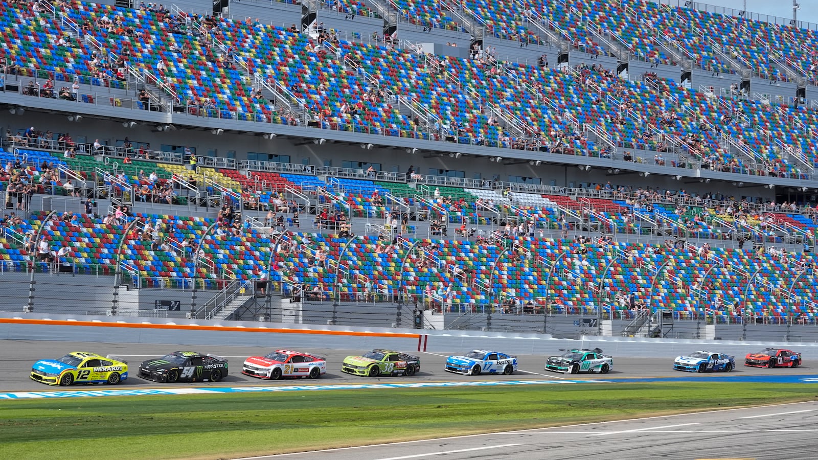 Ryan Blaney (12) leads a pack of cars on the front stretch during a practice session for the NASCAR Daytona 500 auto race at Daytona International Speedway, Saturday, July 15, 2025, in Daytona Beach, Fla. (AP Photo/John Raoux)