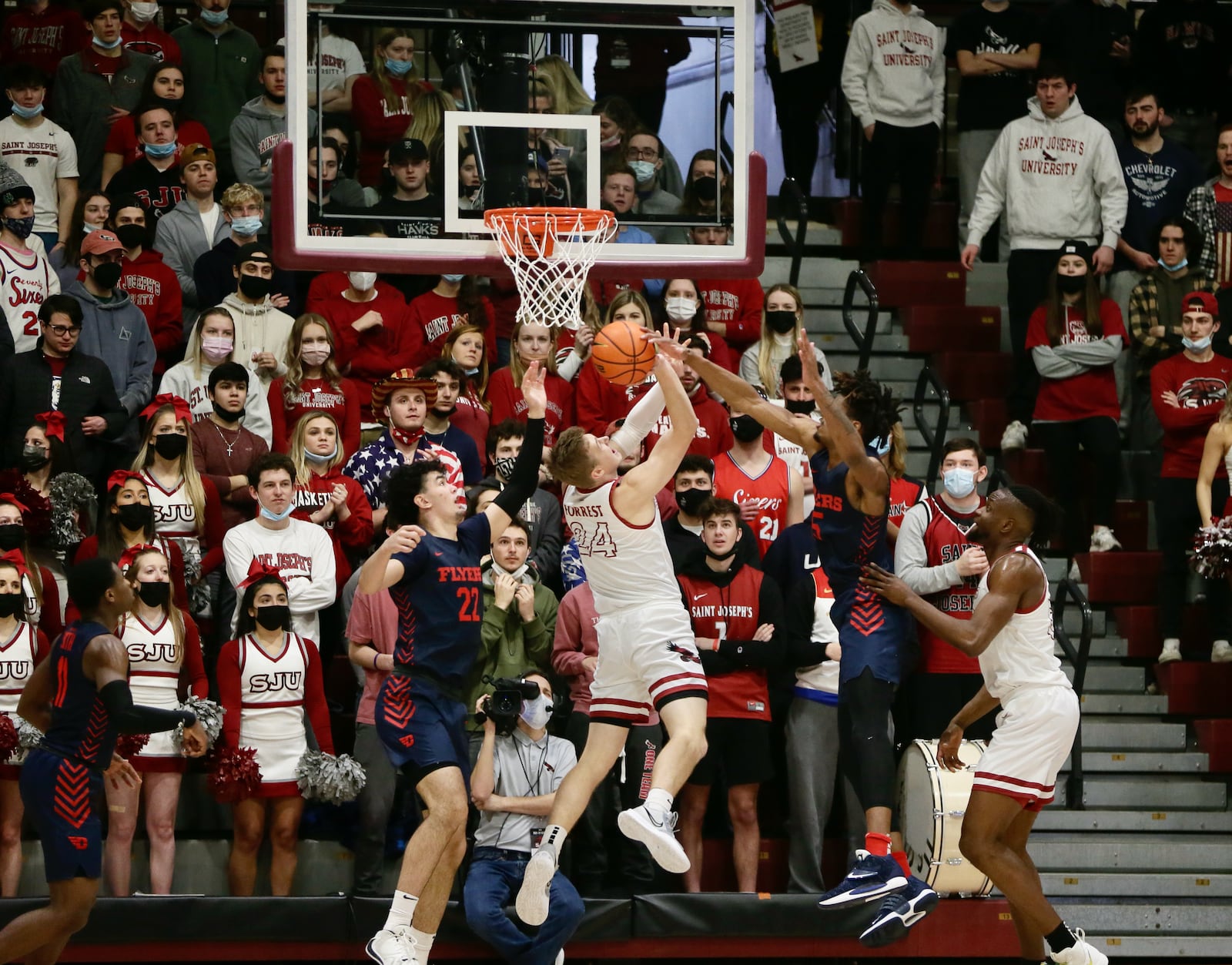 Dayton's DaRon Holmes II blocks a shot against Saint Joseph’s on Saturday, Feb 19, 2022, at Hagan Arena in Philadelphia, Pa. David Jablonski/Staff