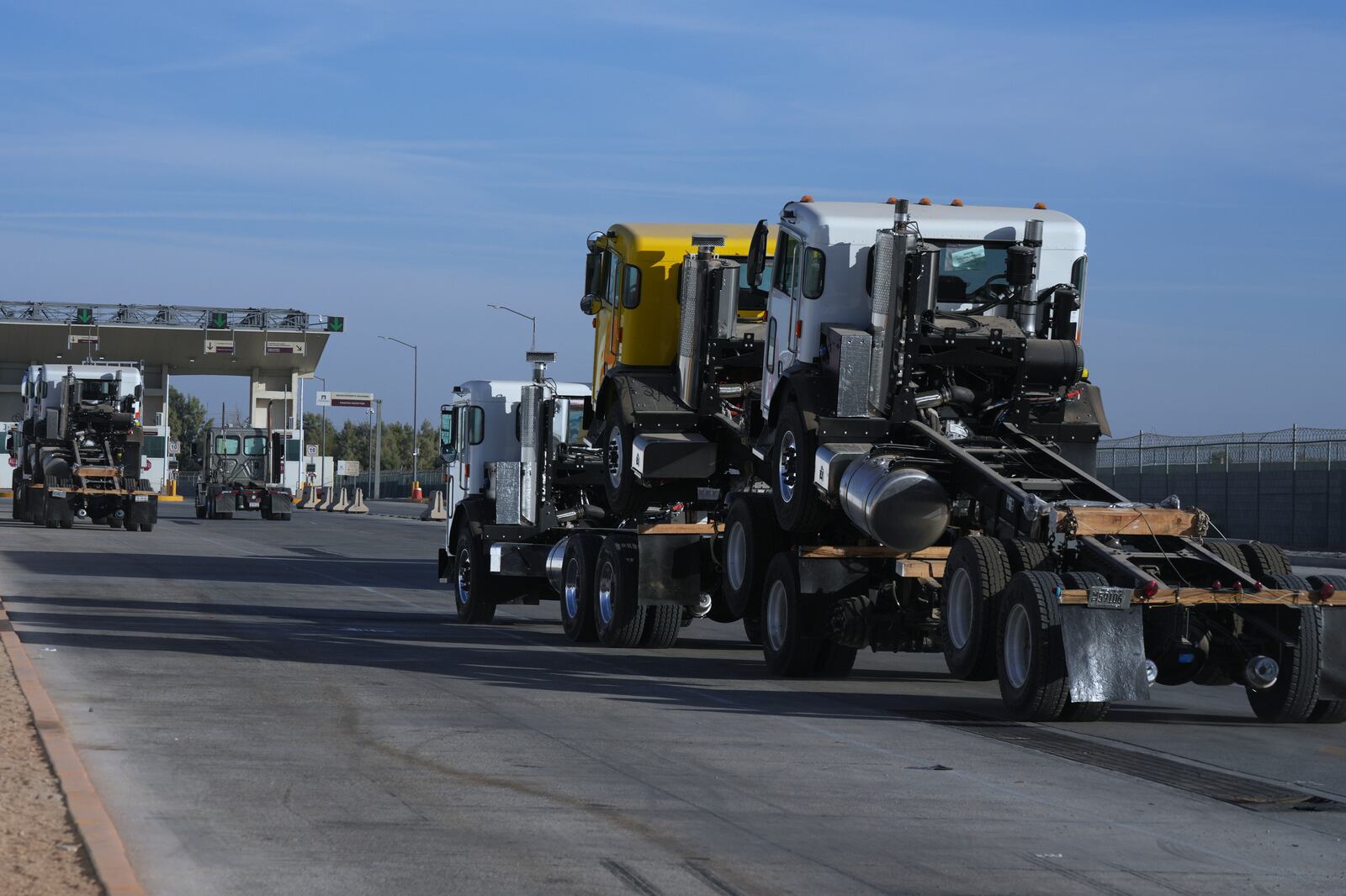 A truck pulls newly assembled truck cabs across the border bridge, from Mexico into the United States, from Mexicali, Mexico, Monday, Feb. 3, 2025. (AP Photo/Fernando Llano)