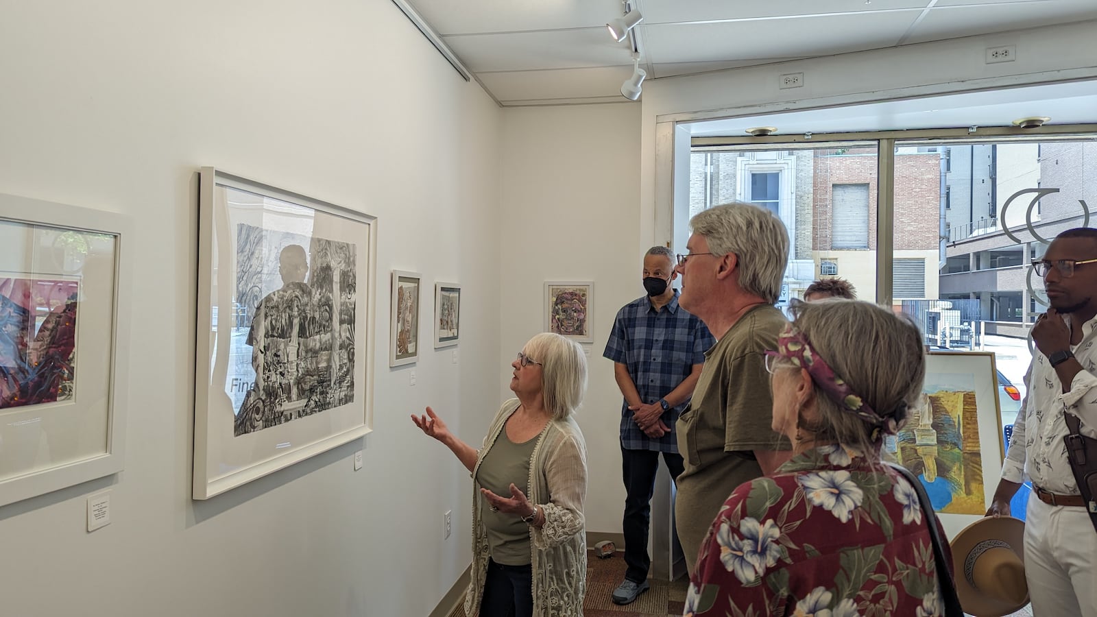 Artist Cynthia Kukla gives a gallery talk for her exhibition "Separating the Earth from the Heavens" at the Edward A. Dixon Gallery on N. St. Clair St. in Dayton.