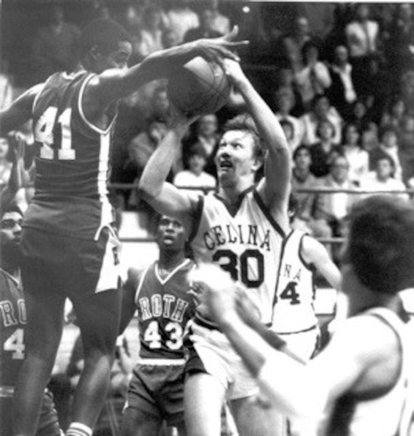 Roth’s Ike Thornton (No. 41) defends against a shot by Celina’s Jim Klosterman (No. 30) shot during a January game at Celina in 1981. Celina, which came into the game with a losing record, pulling the stunning 75-73 upset. They were the only team to beat Roth that year. CONTRIBUTED