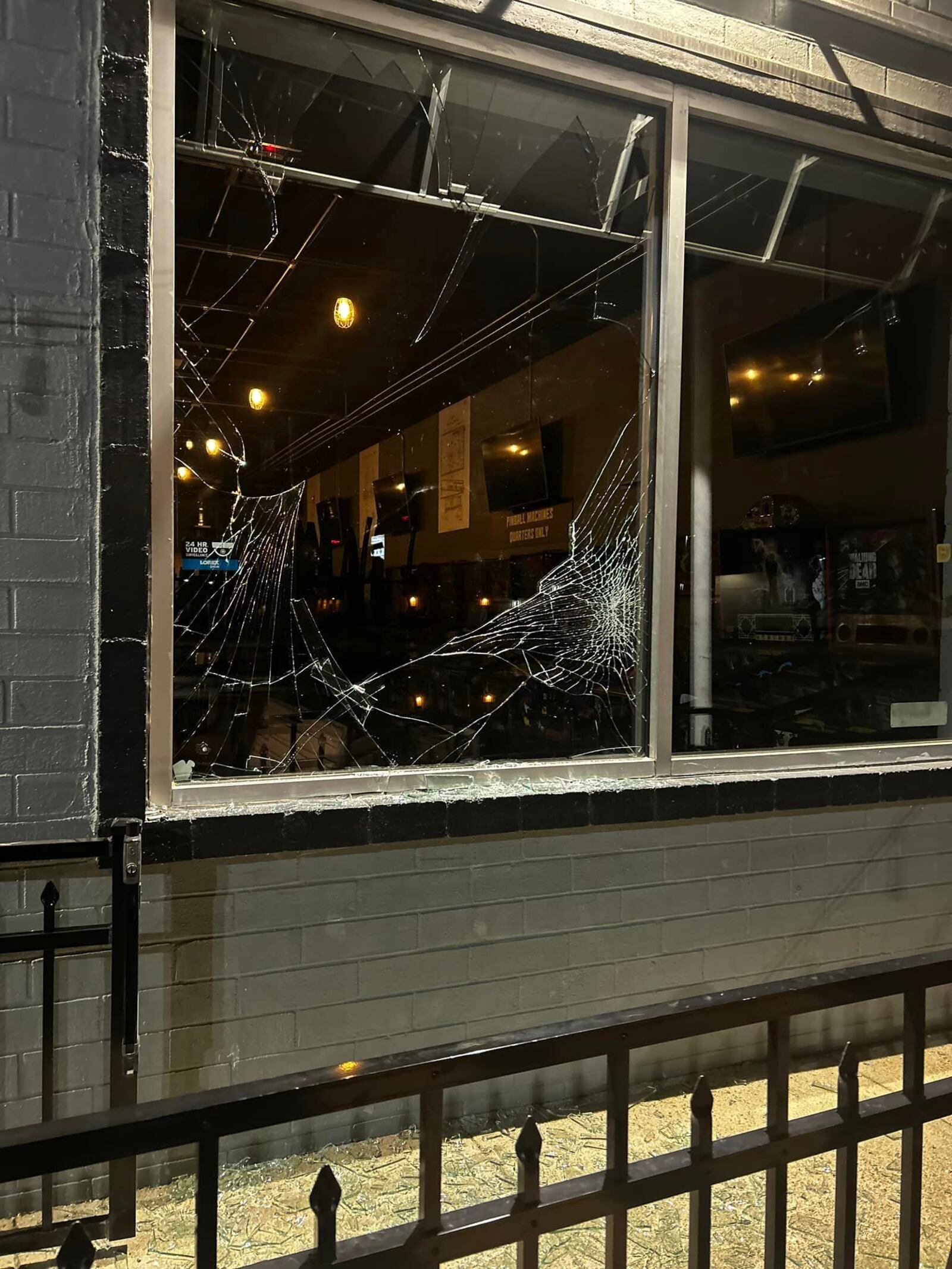 A smashed window at DK Effect arcade and bar after a man was caught on security camera footage throwing a keg through the window. CONTRIBUTED